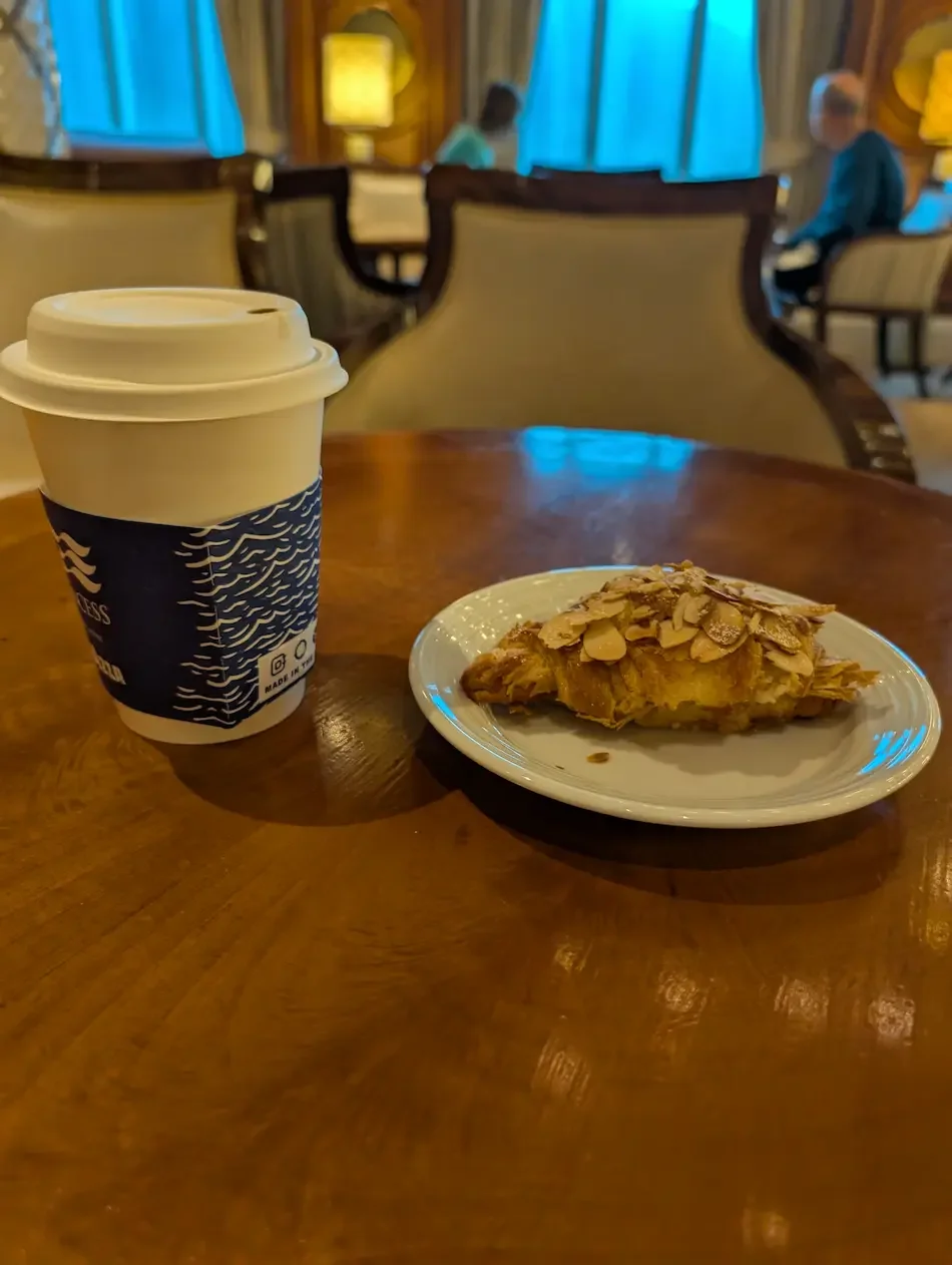 International cafe - almond croissant and coffee