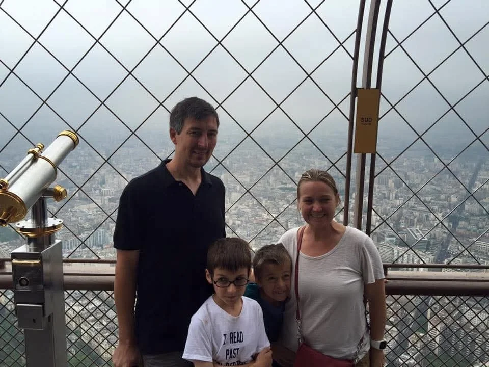 my family at the top of the eiffel tower