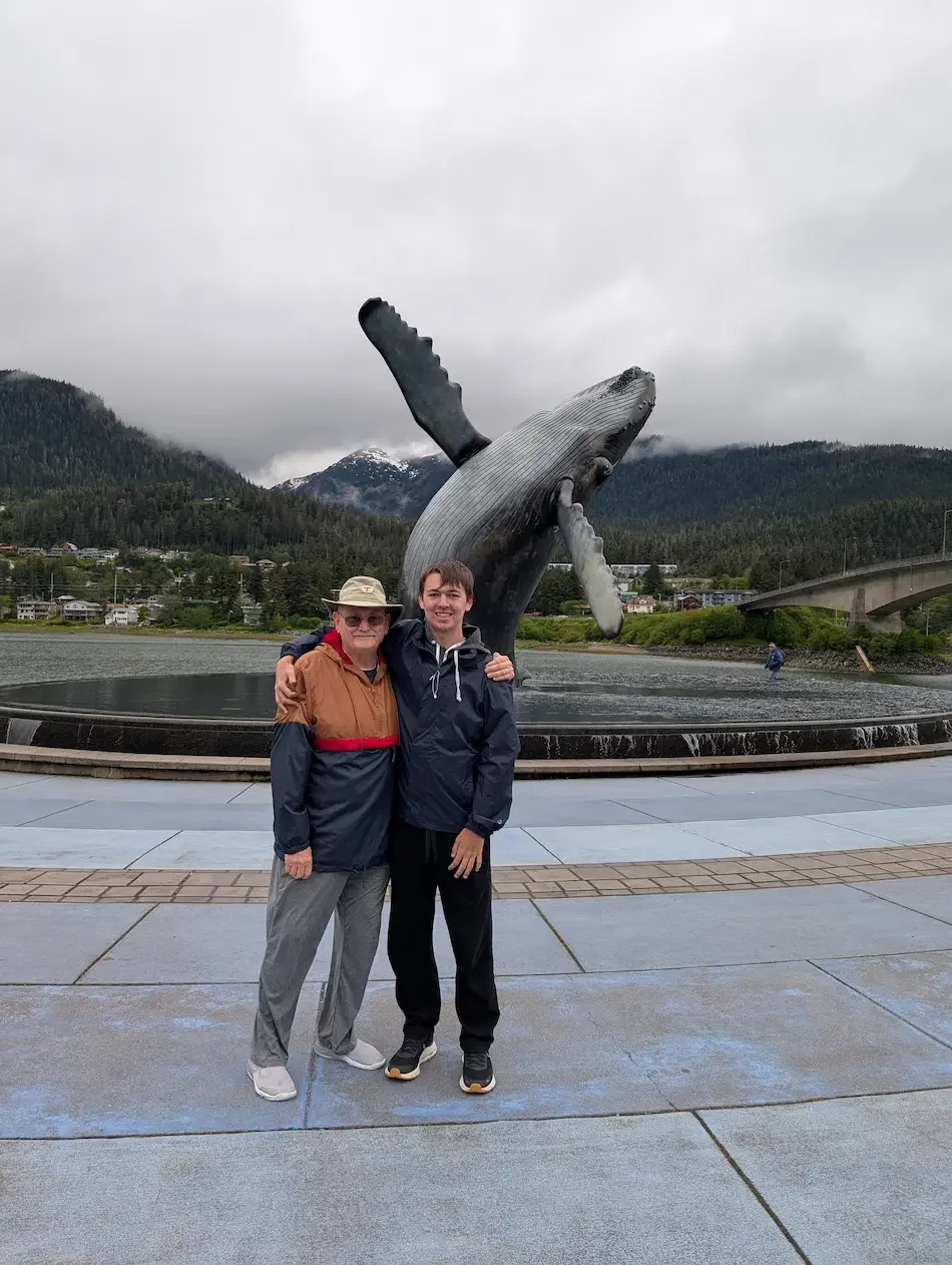 Grandad and grandson at breaching wall statue Juneua