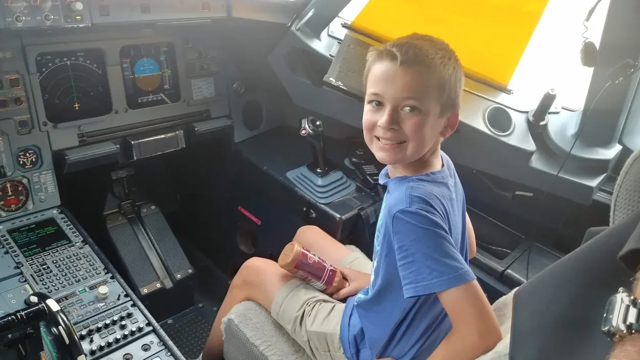 Kid sitting in the cockpit