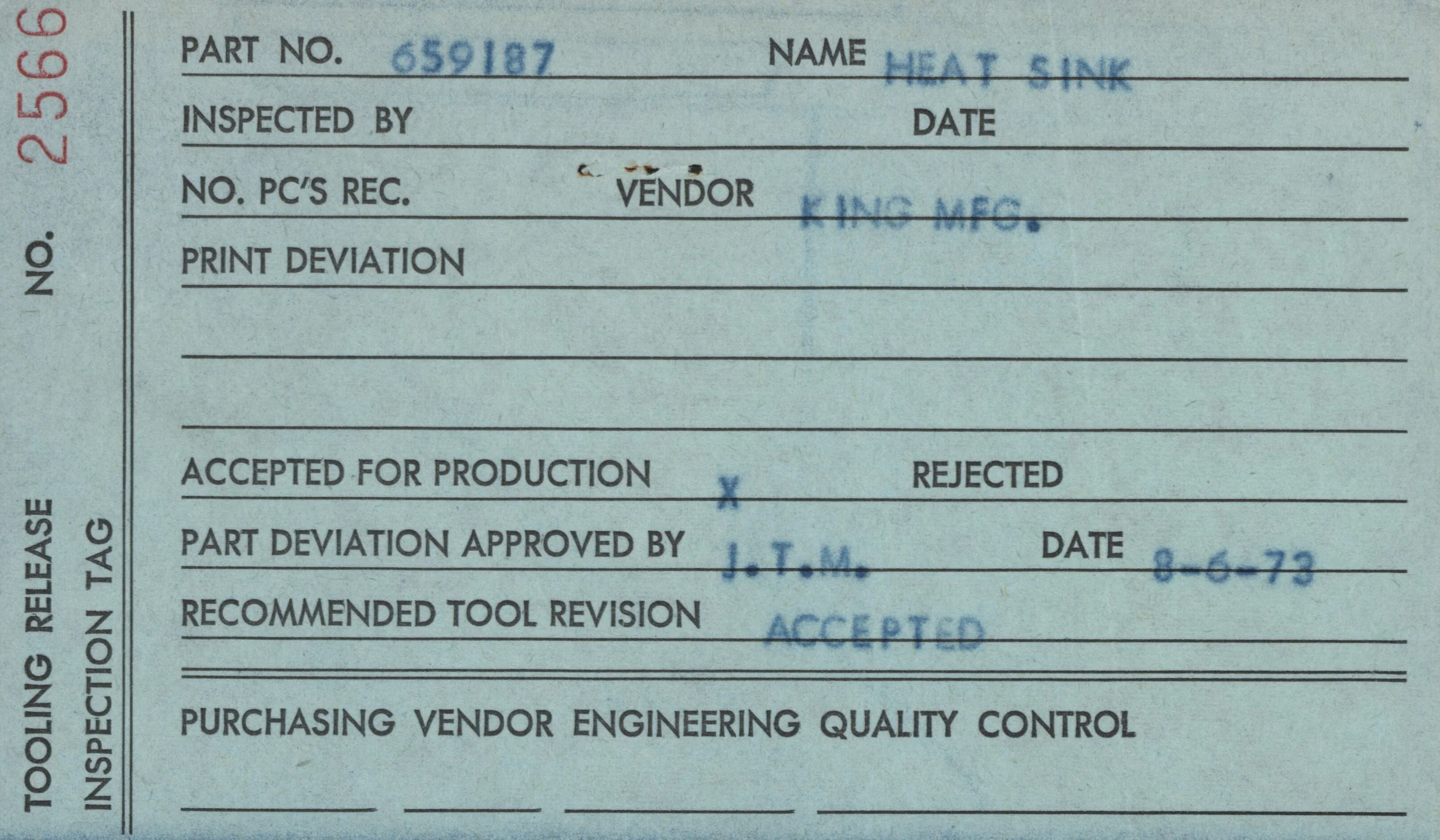 Close-up of a technical document or label with handwritten and printed information, including part number 659187, and the name Heat Sink, with some stamps and signatures.