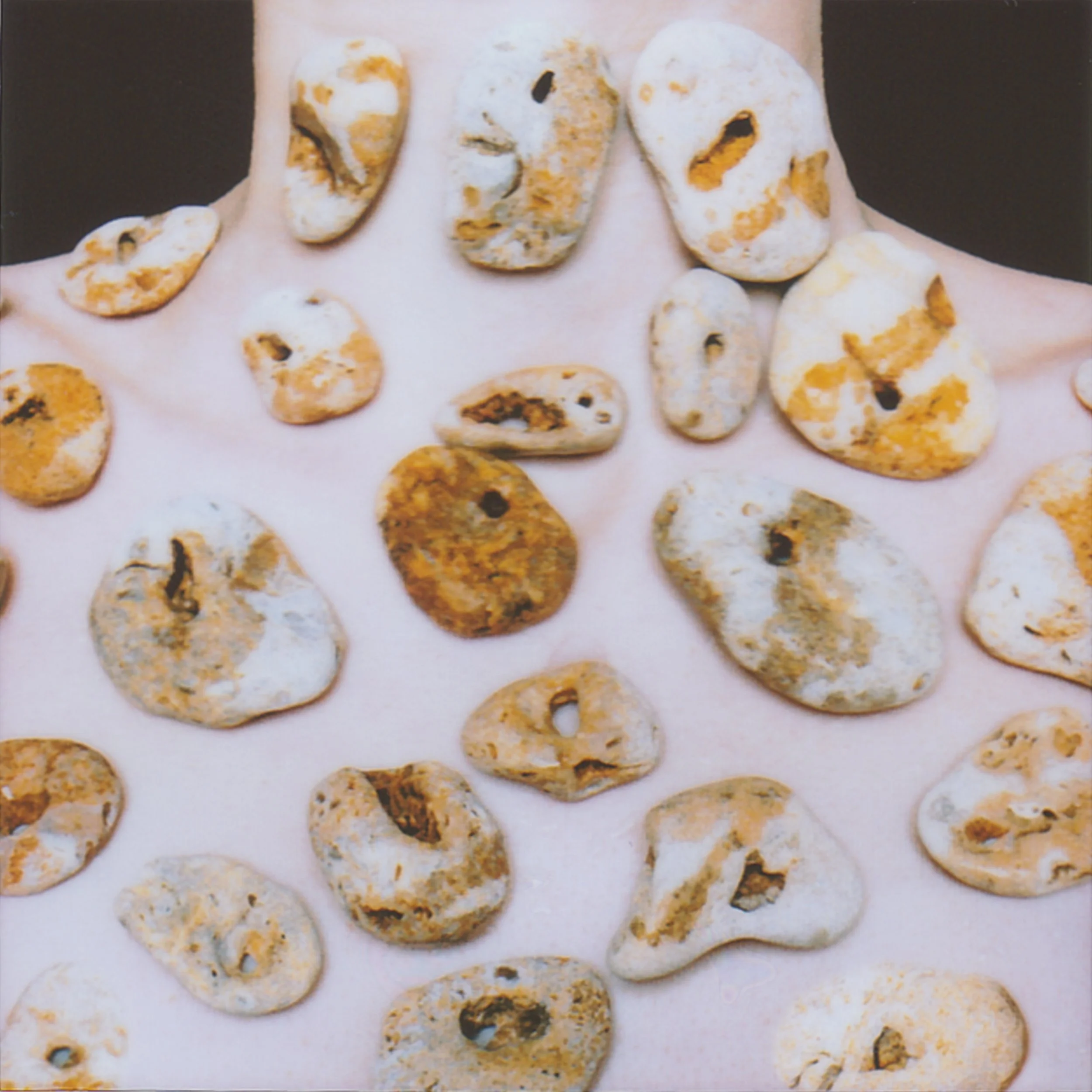 Mom and I walk along the Black Sea, searching for a stone with a hole, for luck. We peer into every centimeter of sand so we won’t miss the right stone and won’t step on a jellyfish. The sun warms my back without burning. I keep asking Mom: Does this