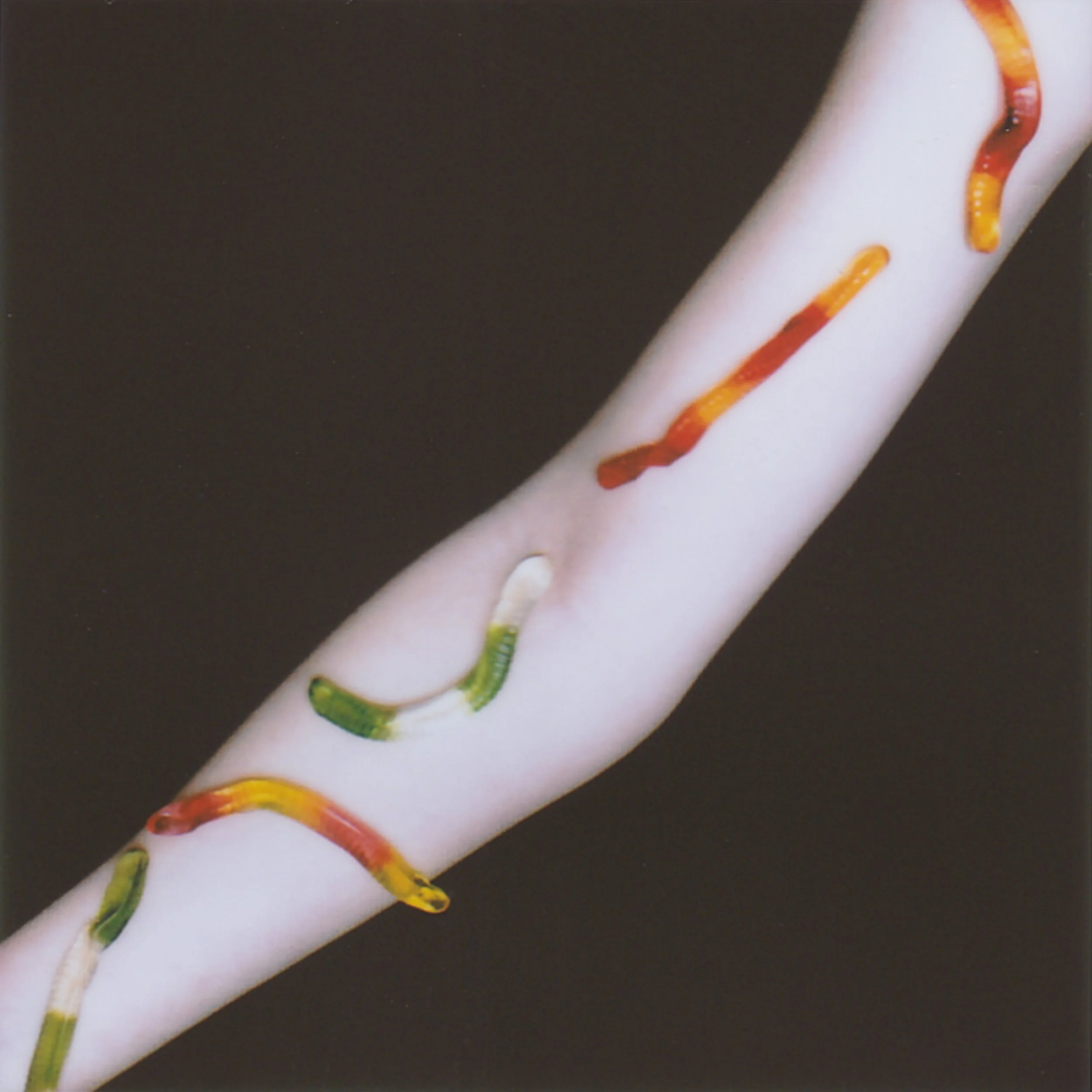 My sister comes for me at kindergarten and takes my hand, guiding me down the city’s empty main street. She asks if I know what the gesture means and flashes the middle finger. I admit I don’t. She laughs.

We slip into a small grocery shop. By the r