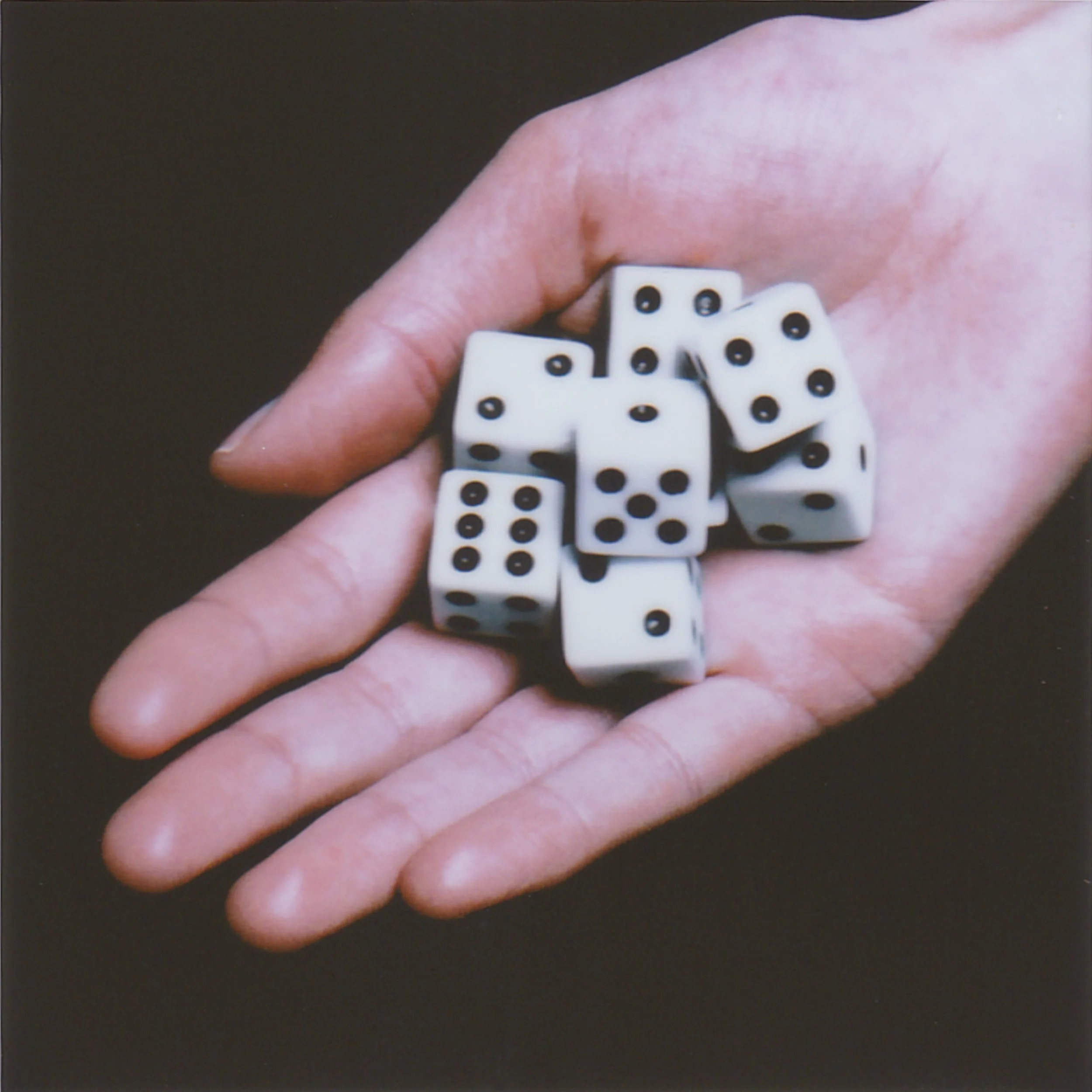 In the living room cabinet, there’s a special shelf where all the interesting things live: magazines, the remote, board games. On Saturdays, Dad usually pulls out checkers, Battleship, or a deck of cards, and we play together. I wish Mom would play t