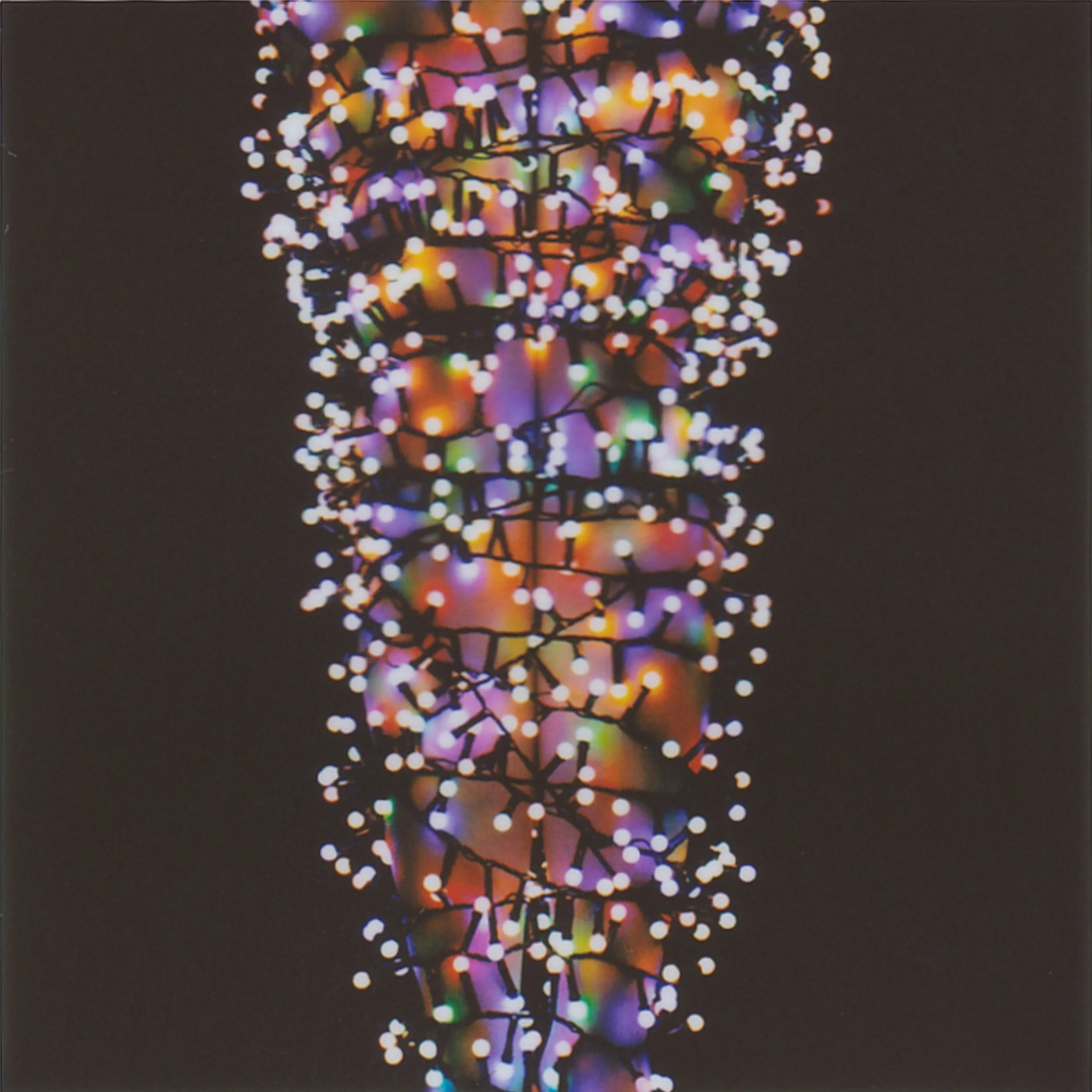 I fall asleep in the living room in front of the TV because the sofa in my room is broken and won’t unfold. The Christmas tree stands right before me; the main light is off, and only the fairy lights glow. I wait for my favorite mode—when all the lig