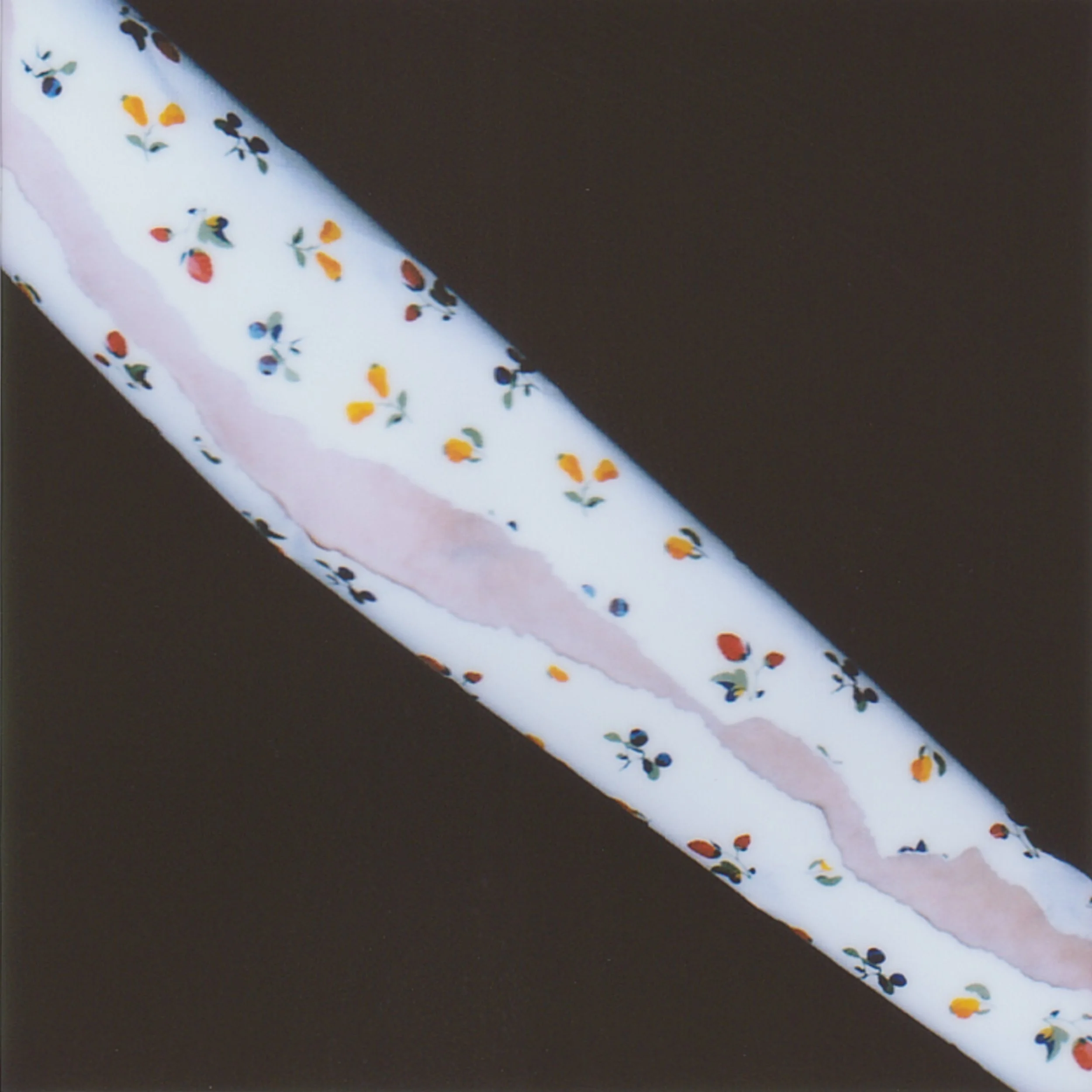 The kitchen wallpaper in Baku—small flowers, red, yellow, blue. So bright, so strange with joy, you can lose yourself just looking. At home in Luhansk, the kitchen walls are lined with dull, indifferent tile.