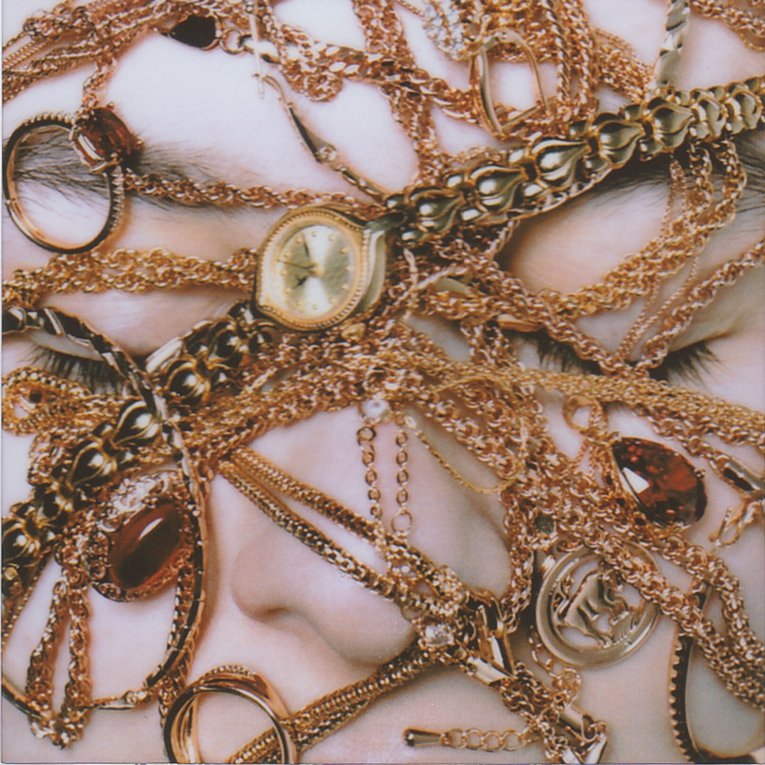 Mom lifts the family gold from a crinkling cellophane bag and spreads it across the sofa. She never wears it—she keeps it safe, for some unnamed rainy day.
I study the treasure, slip on a ruby ring too large for a child’s fingers, too grand for ordin