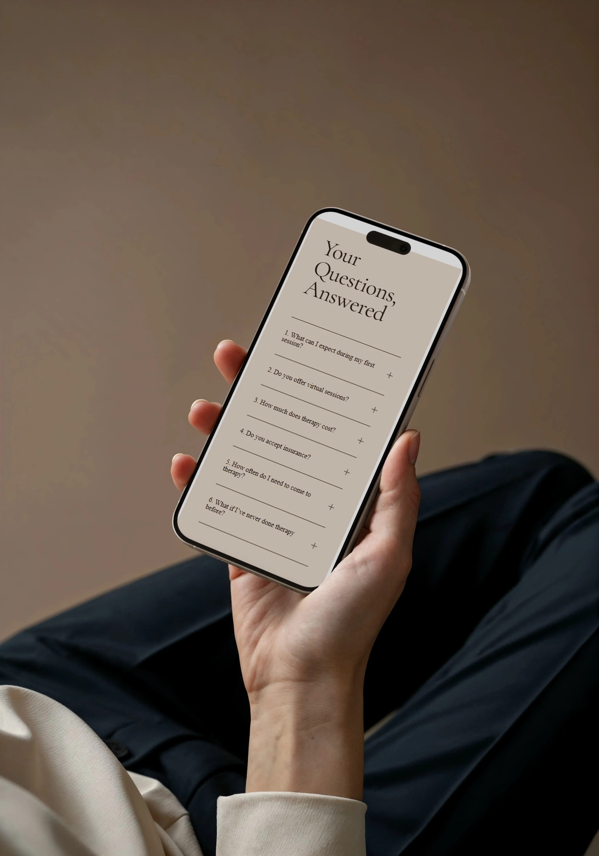 Therapist FAQ page on a mobile phone, showing a minimalist Squarespace therapy website with a one page layout.