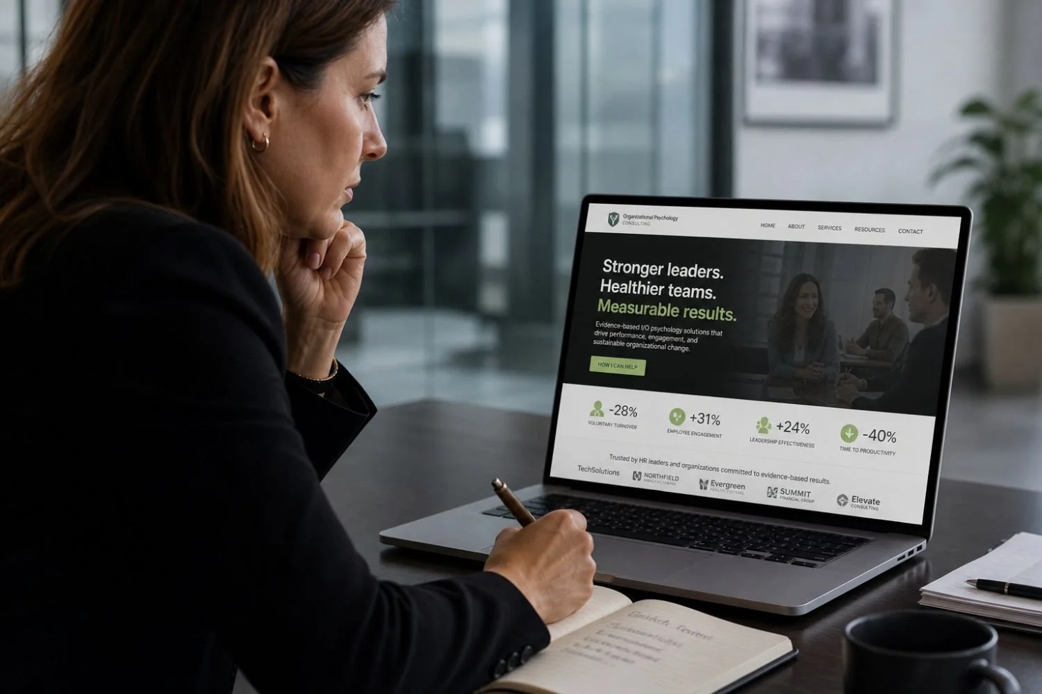 HR executive reviewing organizational psychology consultant website on laptop, highlighting measurable business results, leadership development, employee engagement and performance improvement in corporate environment