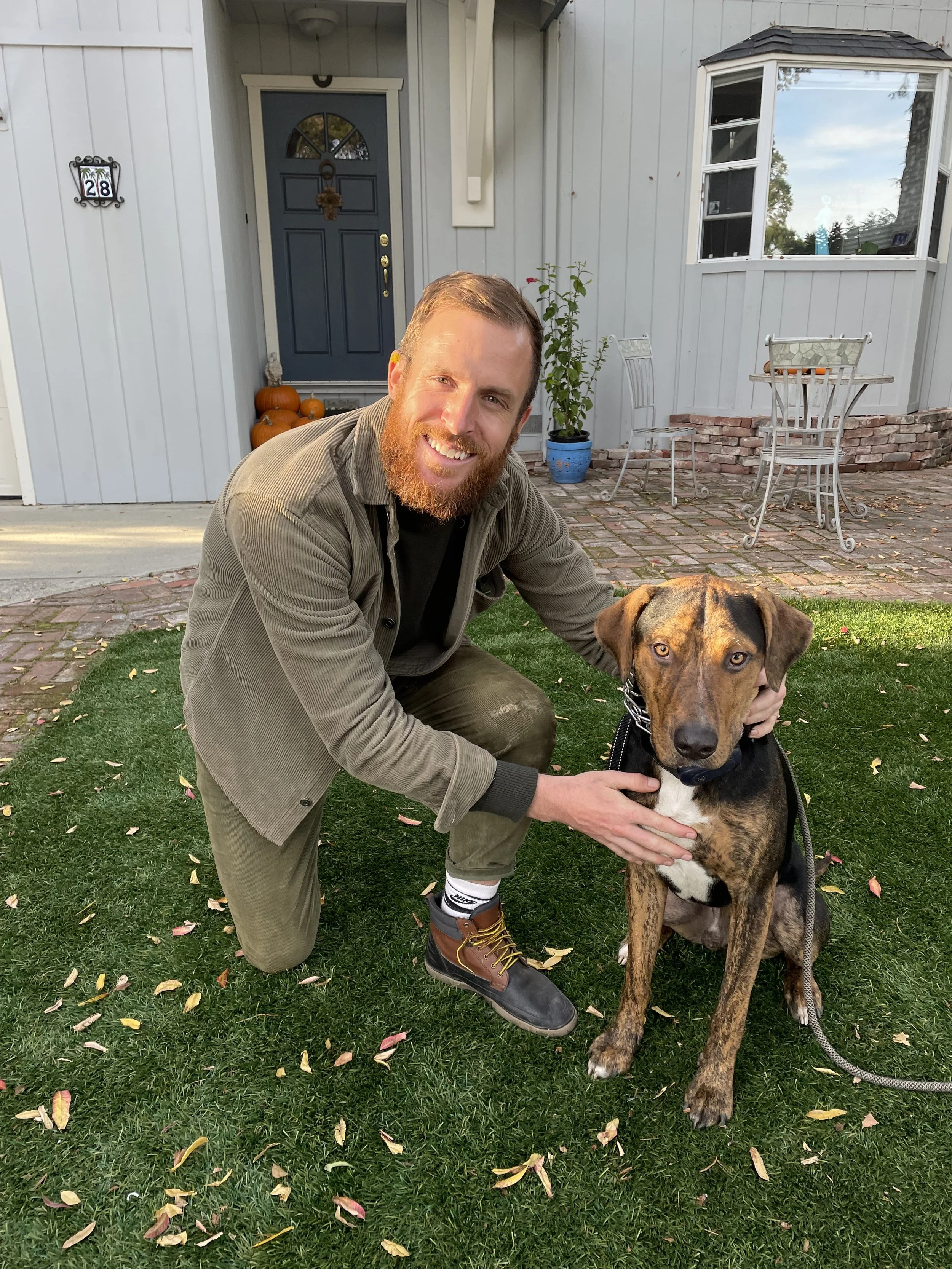 Dr. Charles Gilligan with his dog Deebo at Montecito Physical Therapy in Santa Barbara, CA