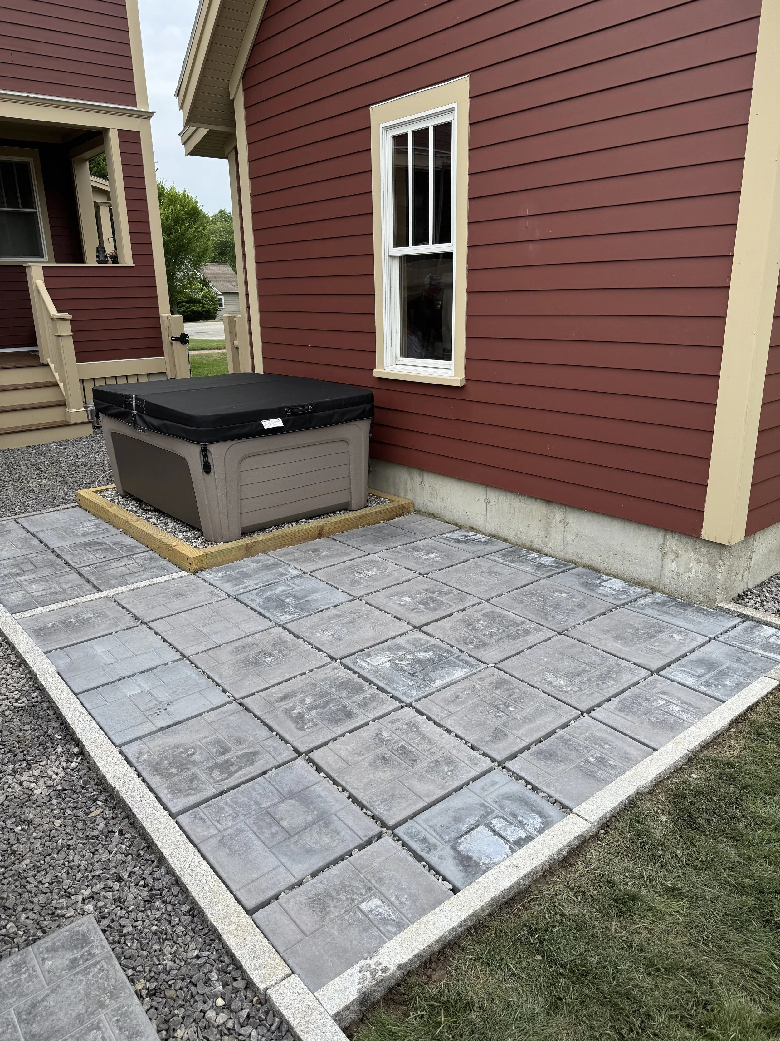 Paver slab patio installation in backyard