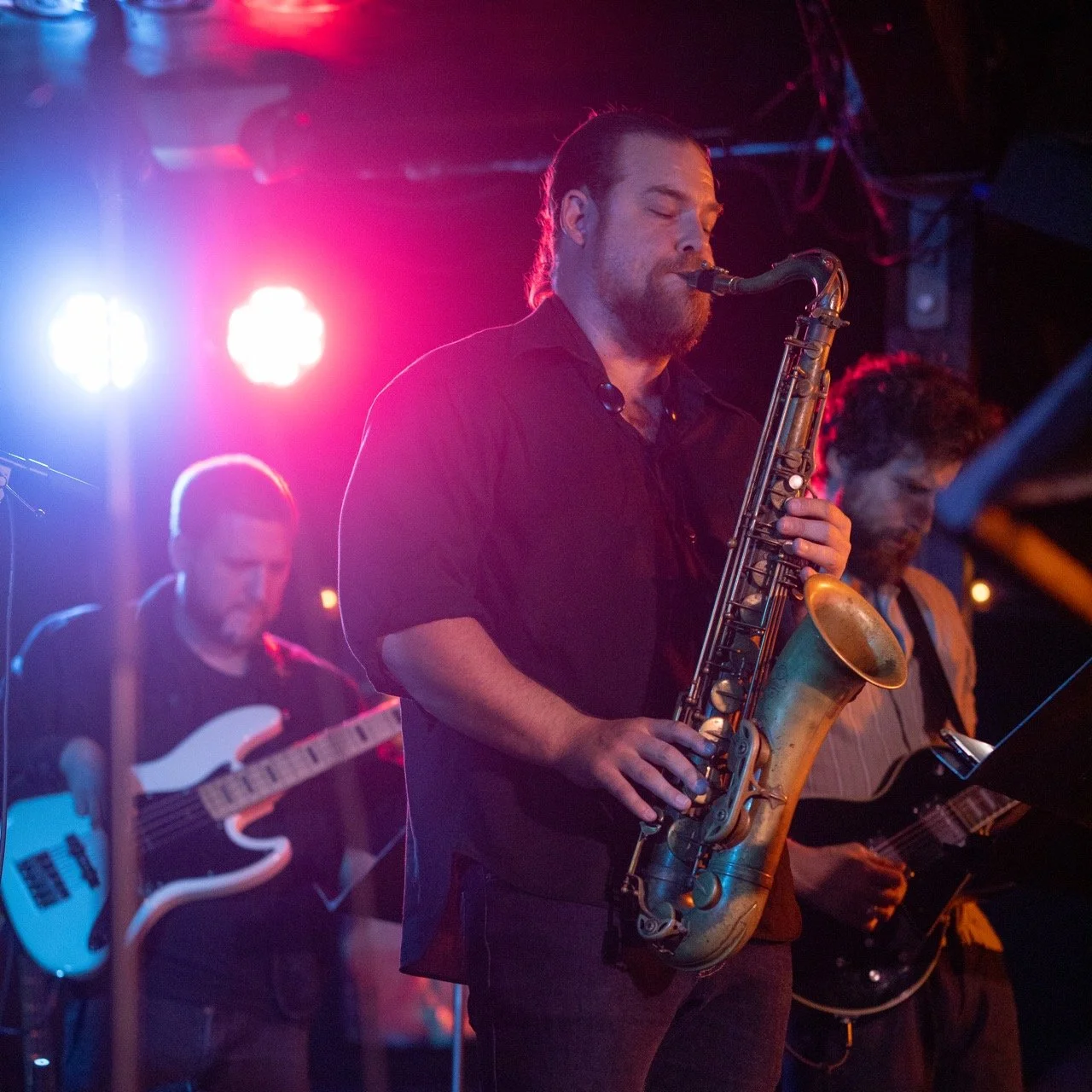 Tenor sax player onstage live.