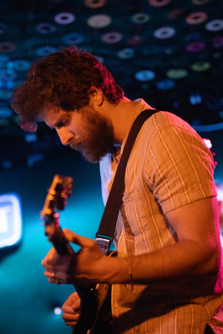 Guitarist onstage performing.