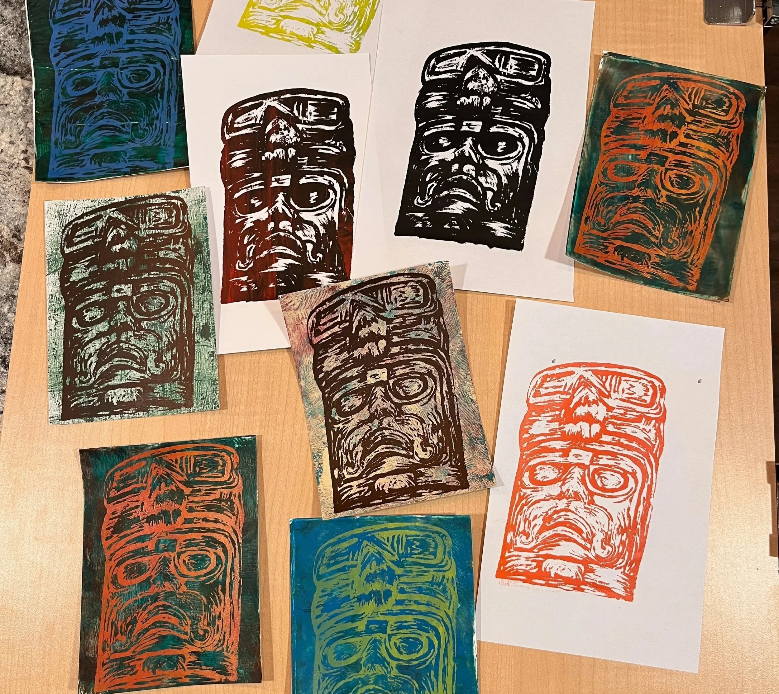 Silkscreen Prints on paper that was coloured using a Gelli Plate