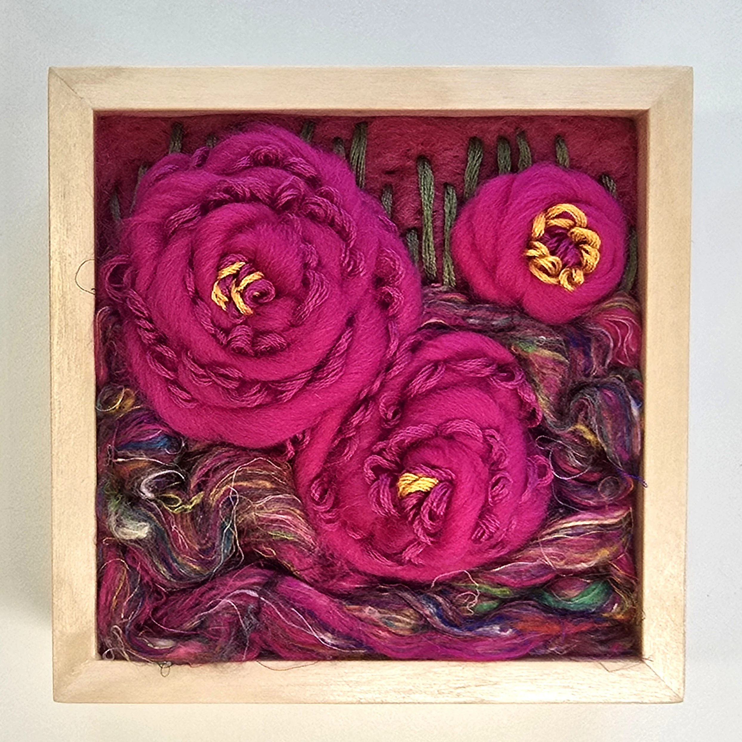 Wild Roses | Needle felted wool, handspun art yarn, silk roving, & stitching in a solid birch frame with natural finish | 5" x 5" x 2" | SOLD