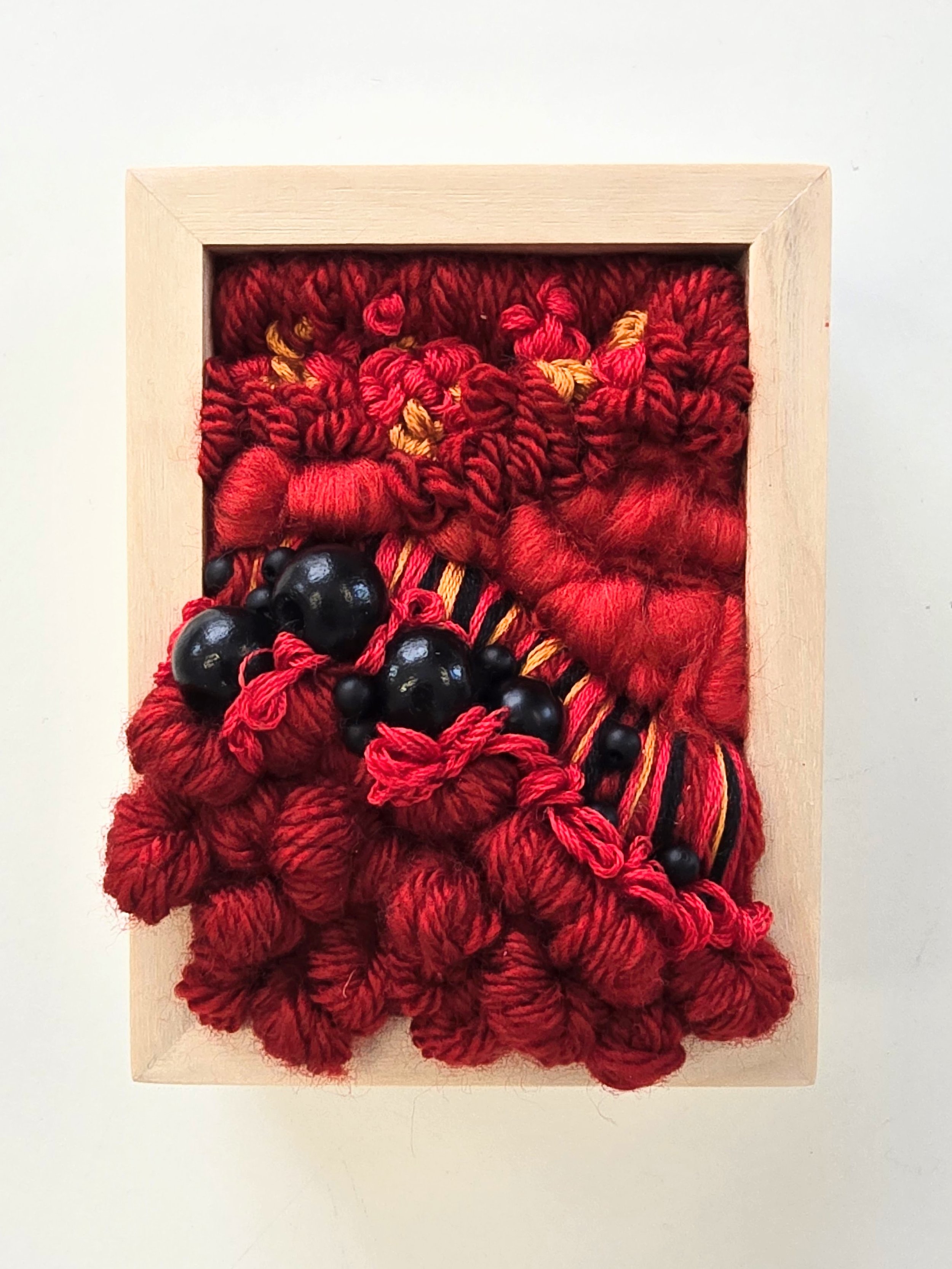 Mini 17 | Stitched mixed yarns, wool roving, cotton thread, and painted wood beading in a solid birch frame with natural finish | 3" x 4" x 1.5" | $50