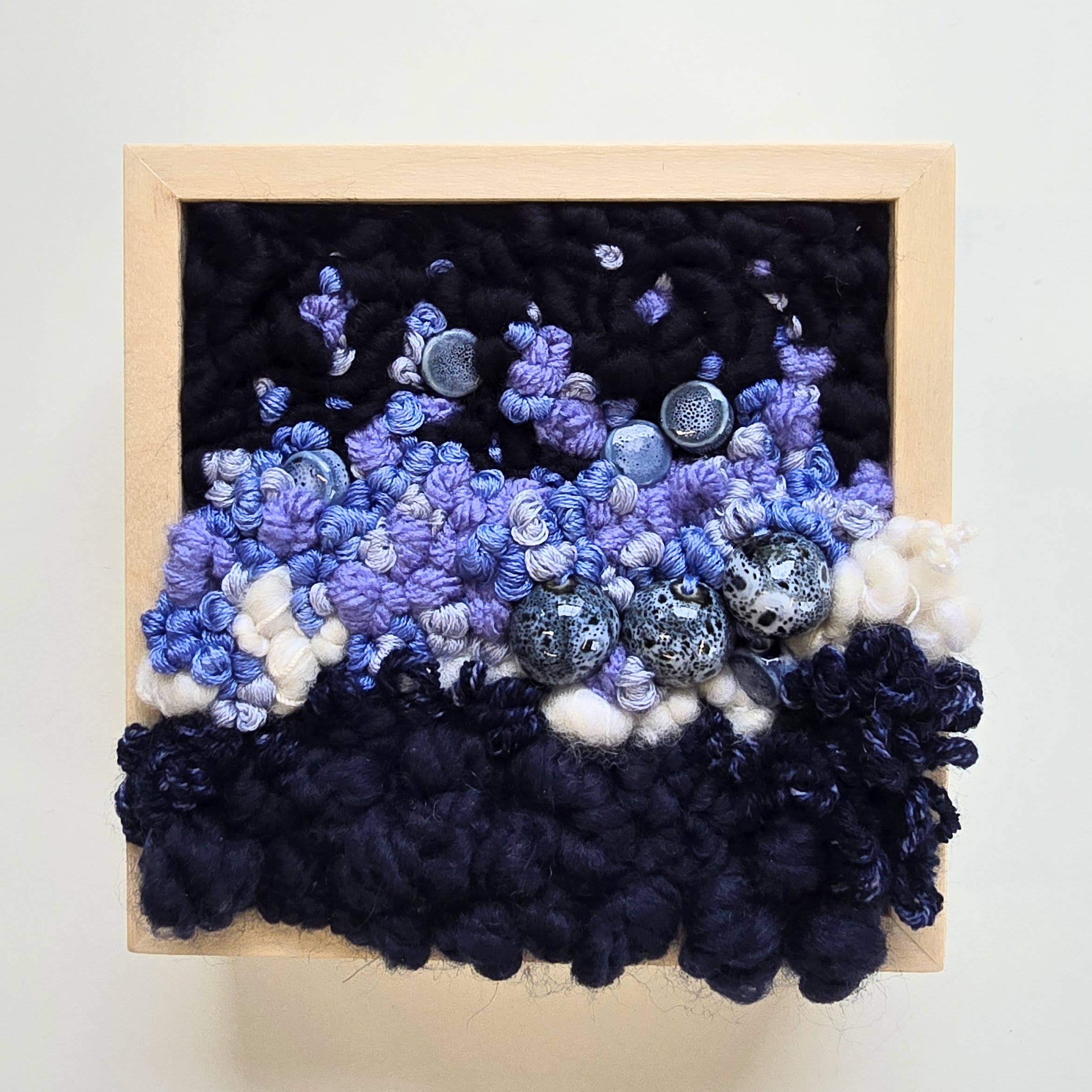 Lilacs At Dusk | Hooked wool, handspun art yarn, mixed yarns, embroidery, & ceramic beads in a solid birch frame with natural finish | 5” x 5” x 2” | $125
