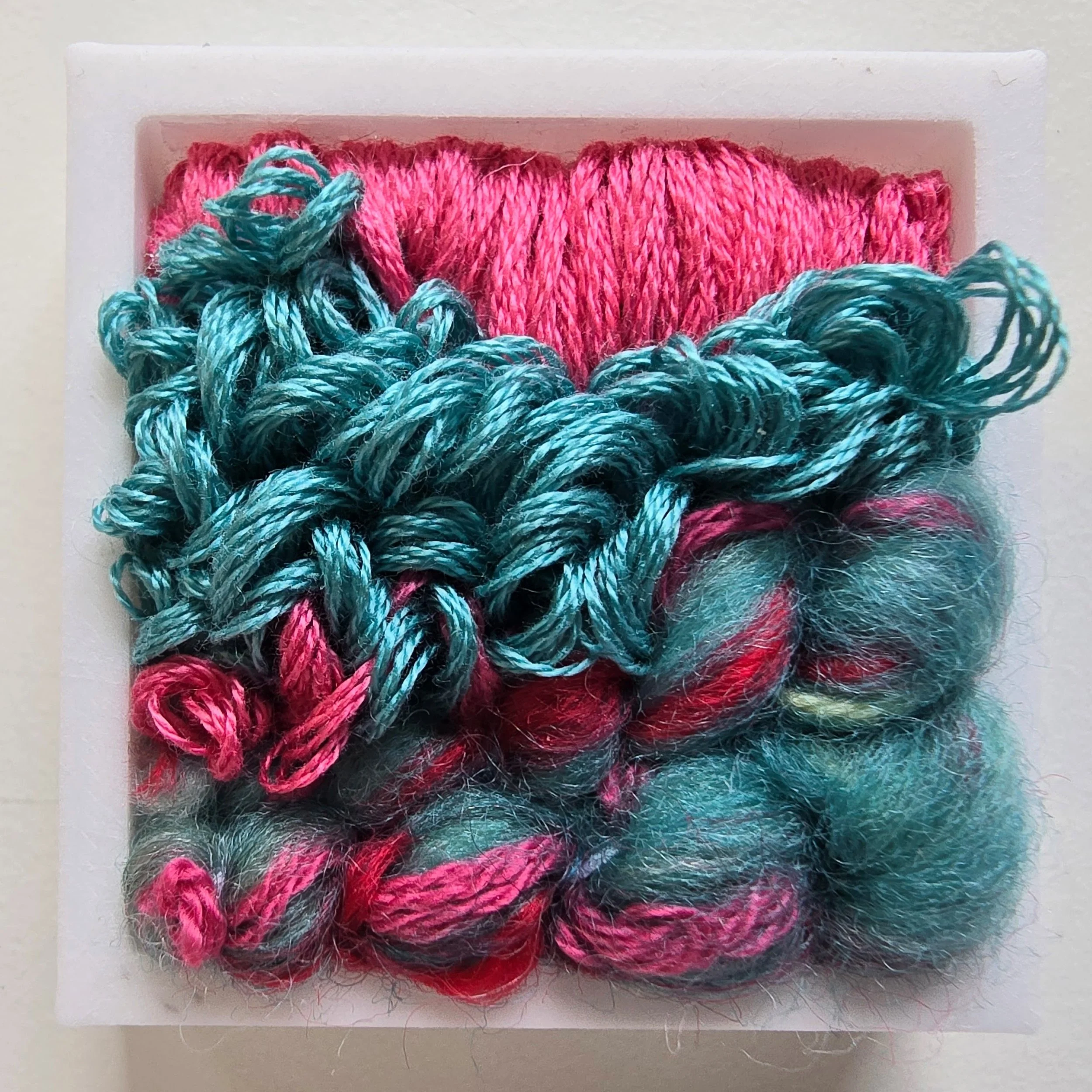 Mini 3 | Needle felted wool, handspun art yarn, & stitching in a white composite frame | 1.75" x 1.75" x 0.5" | $30 (CDN) ***Available at Tiny Ass Art Gallery, St. Jacobs, Ontario in May 2026