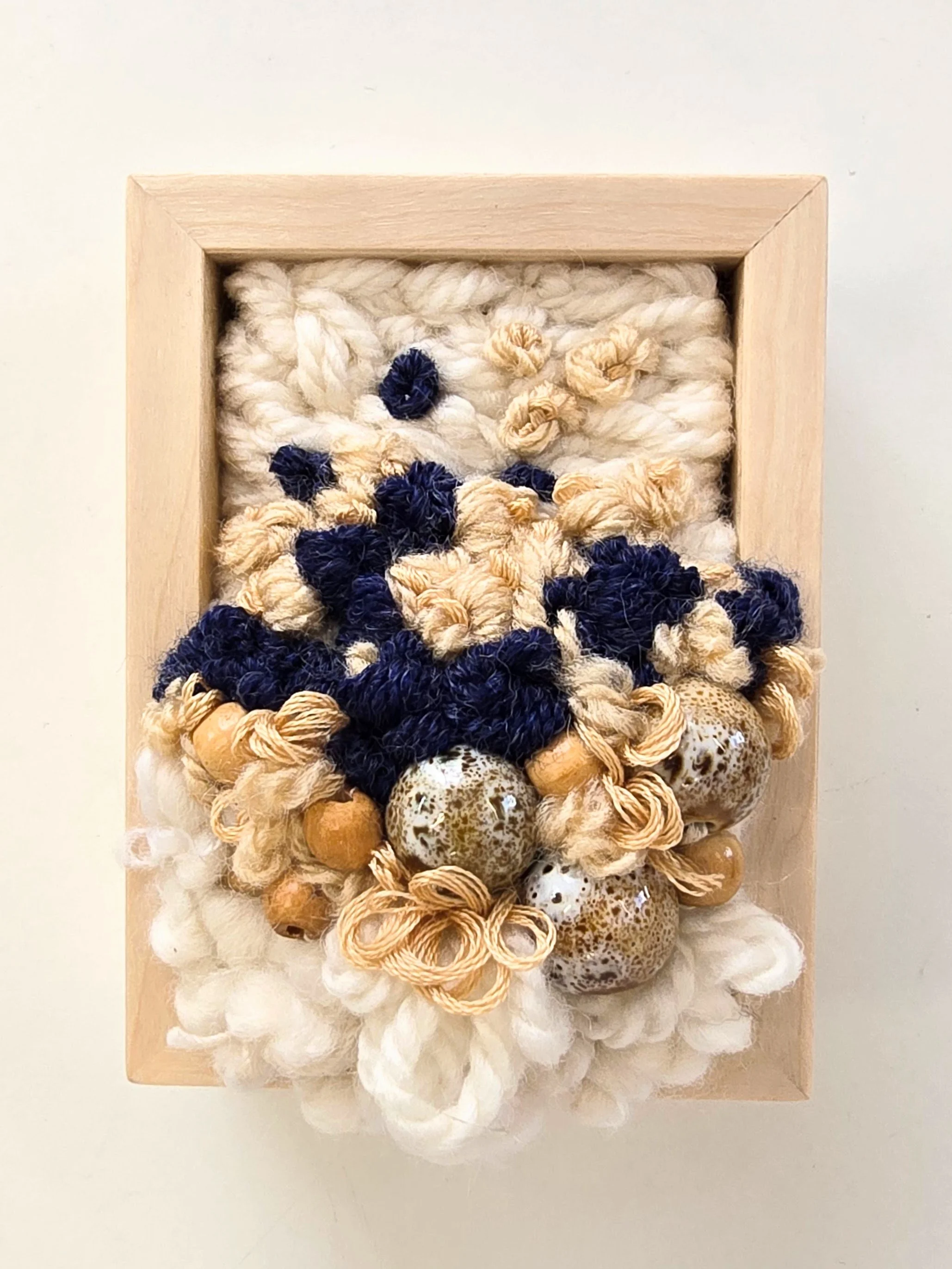 Mini 14 | Stitched mixed yarns, handspun art yarn, cotton thread, and ceramic & wood beading in a solid birch frame with natural finish | 3" x 4" x 1.5" | $50