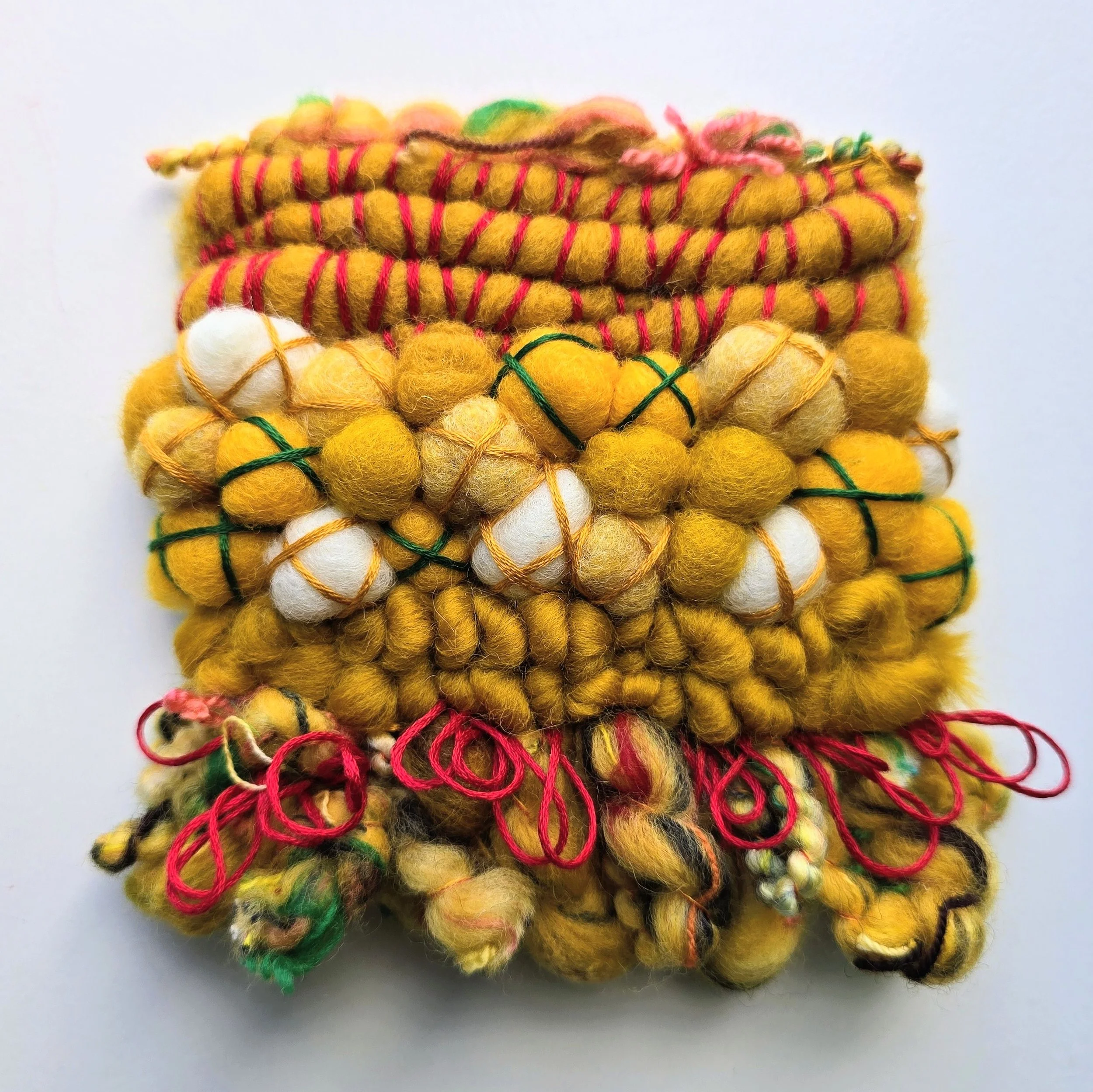 Fiesta | Needle felted wool, hand-spun art yarn, & embroidery, mounted on board & ready to hang | 4" x 4" | $25 (CDN) - ON HOLD