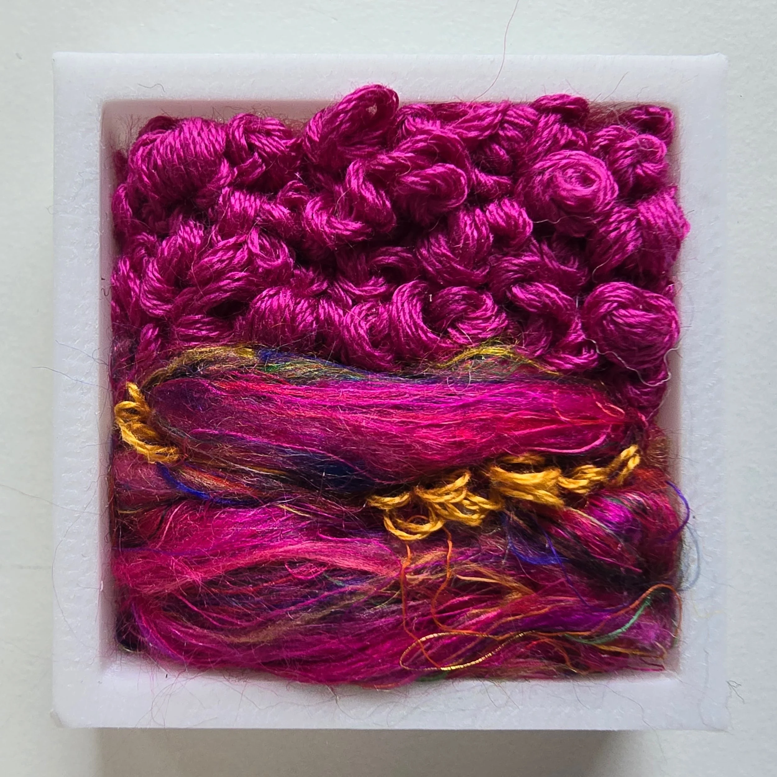 Mini 6 | Needle felted wool, silk roving, & stitching in a white composite frame | 1.75" x 1.75" x 0.5" | $30 (CDN) ***Available at Tiny Ass Art Gallery, St. Jacobs, Ontario in May 2026