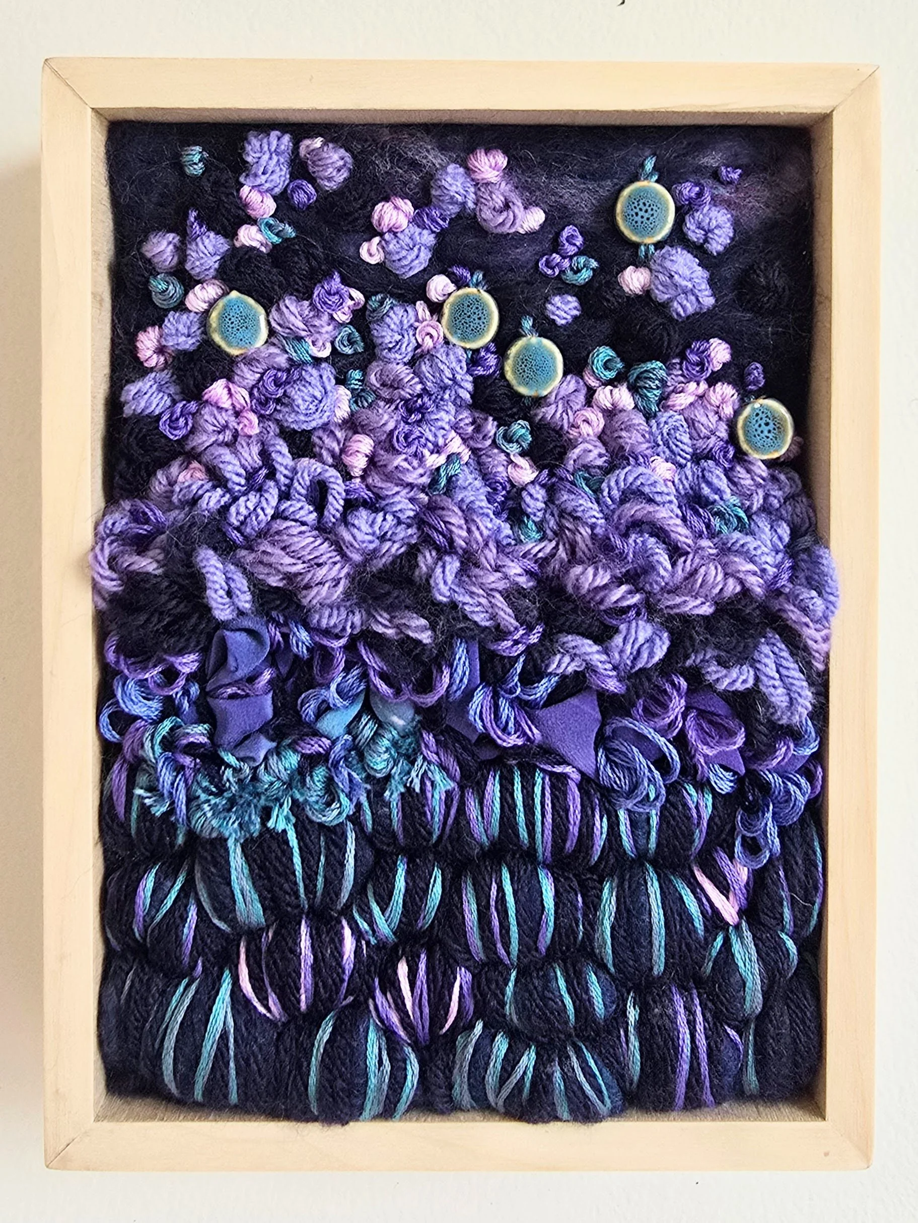 Lavender Haze | Needle felted wool, yarns, hand-painted silk, stitching, & ceramic beads in a solid birch frame with natural finish | 6" x 8" x 2" | $150 (CDN) ***Available at Tiny Ass Art Gallery, St. Jacobs, Ontario in May 2026