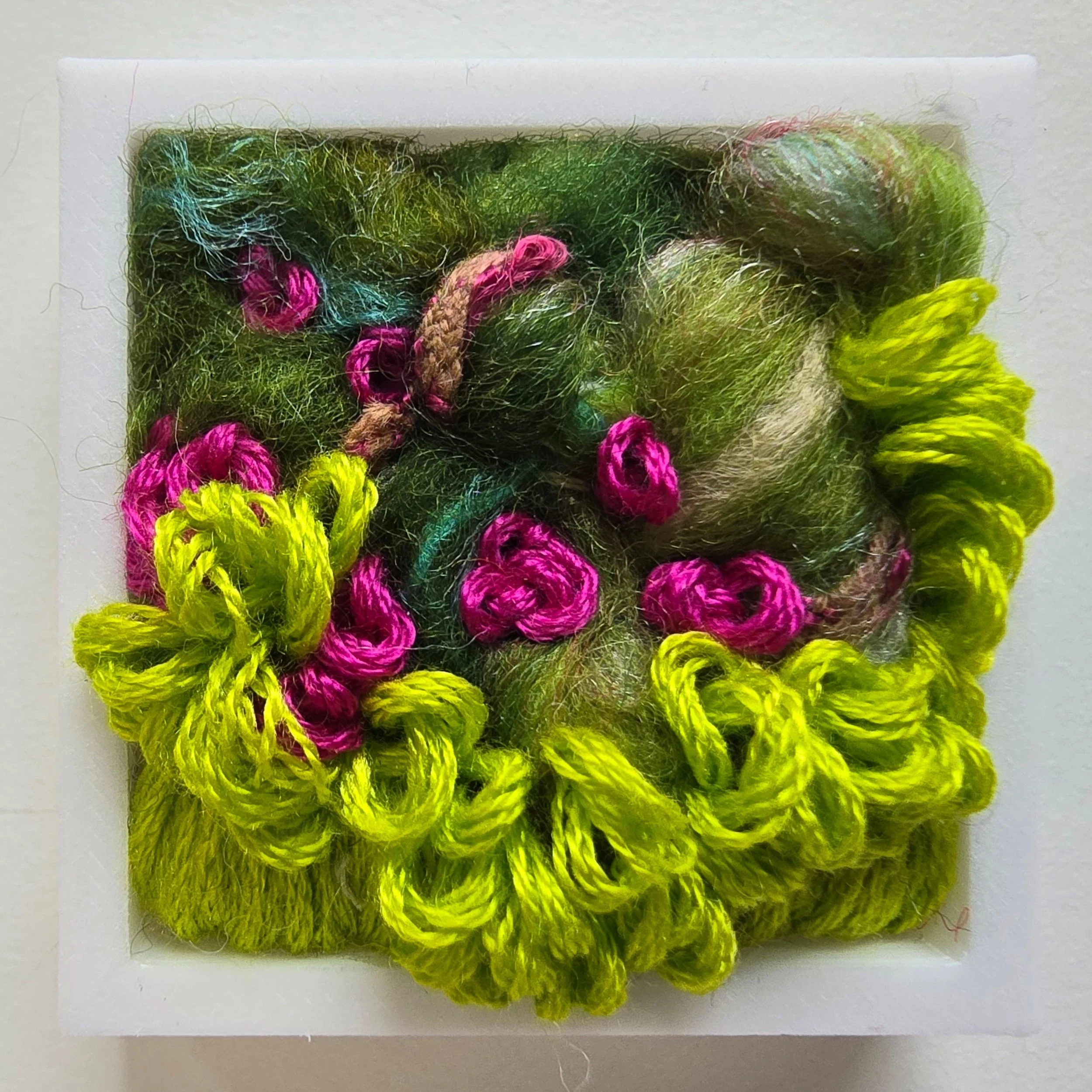 Mini 4 | Needle felted wool, handspun art yarn, & stitching in a white composite frame | 1.75" x 1.75" x 0.5" | $30 (CDN) ***Available at Tiny Ass Art Gallery, St. Jacobs, Ontario in May 2026