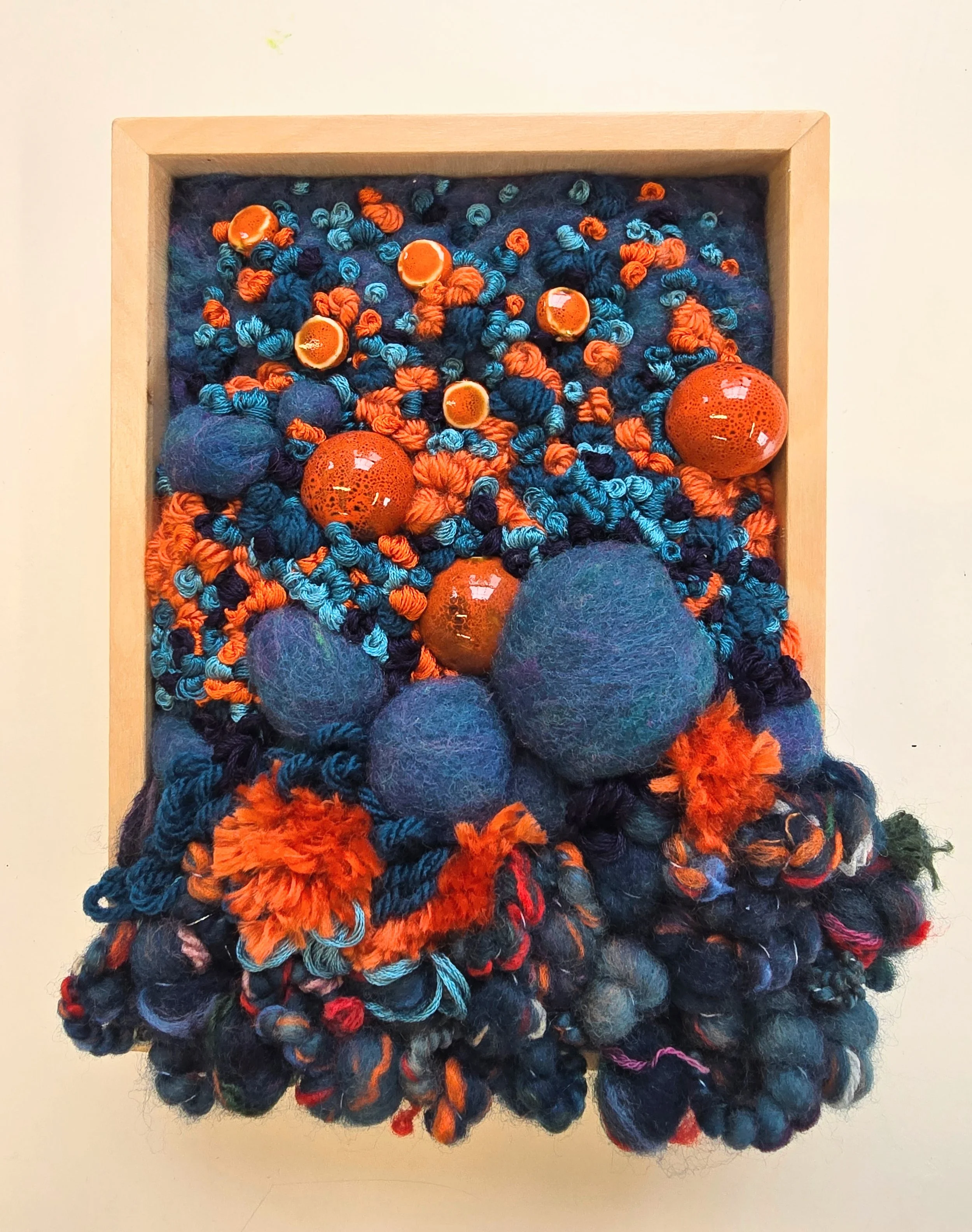 Plant A Strange Garden | Needle felted wool, handspun art yarn, stitched yarns, embroidery, & ceramic beading, in a solid birch frame with natural finish | 6” x 8” x 2” | SOLD
