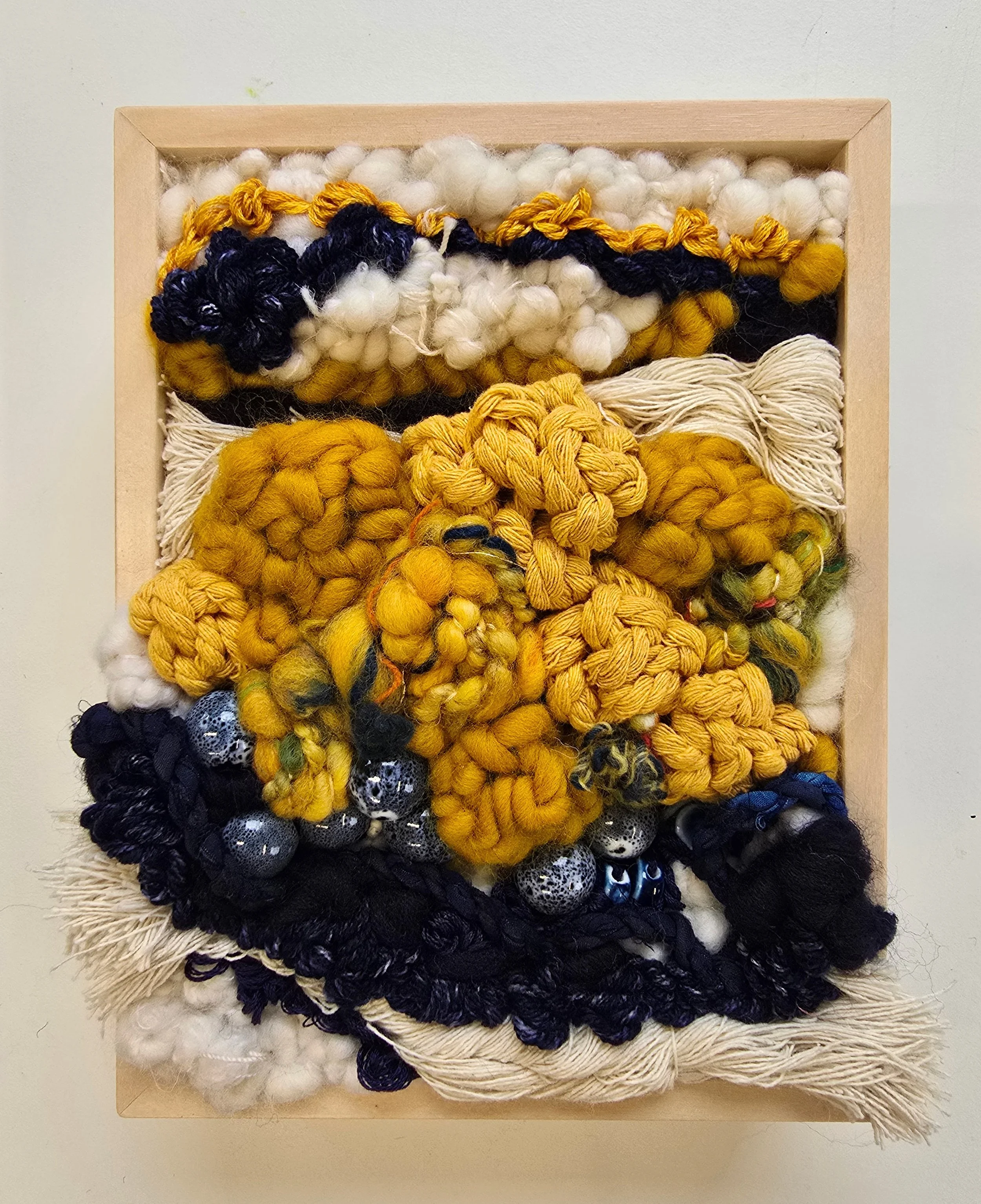 Tupelo Honey | Hooked wool and mixed yarns, handspun art yarn, cotton rope, embroidery, & ceramic beading in a solid birch frame with natural finish | 6” x 8” x 2” | 
$175
