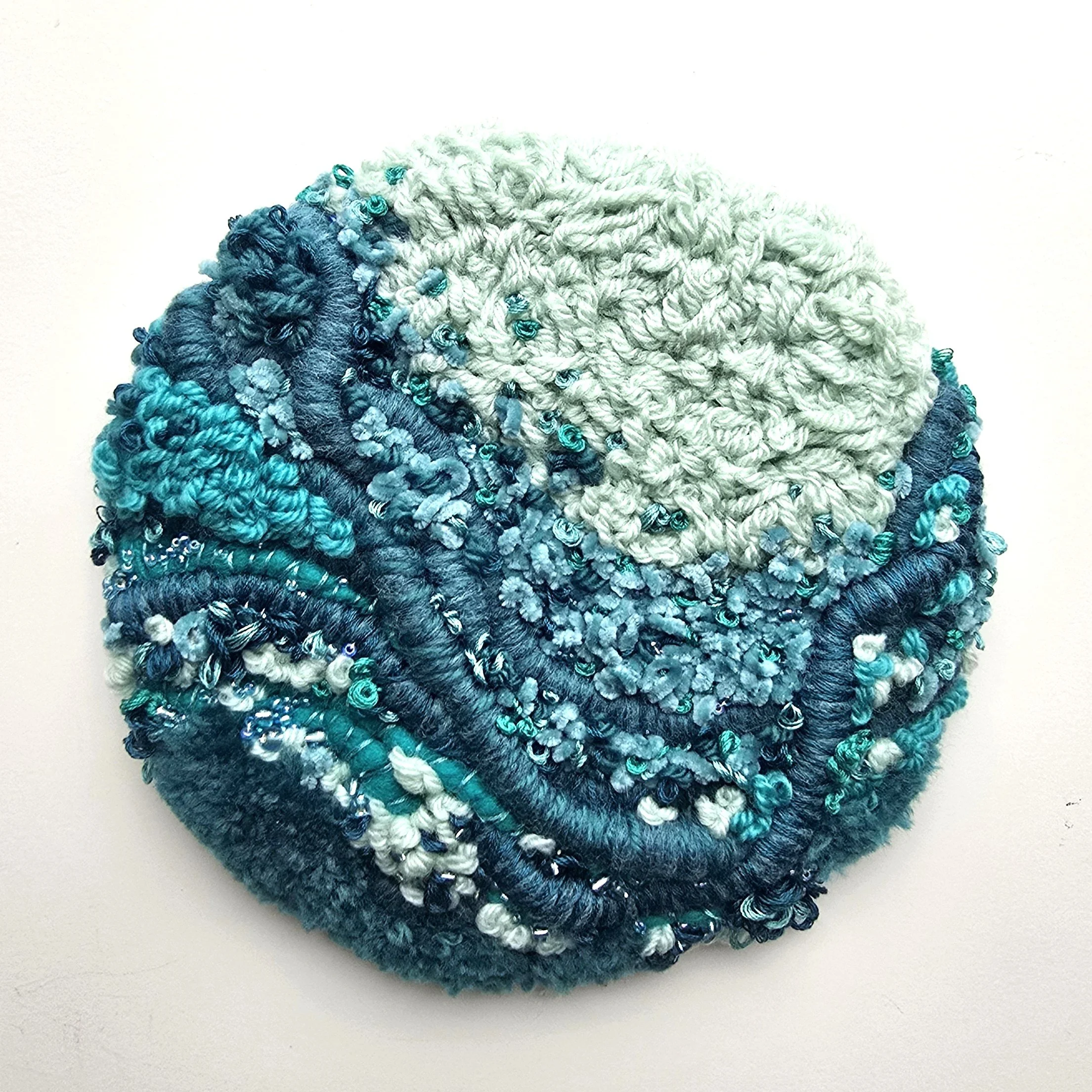 Palauea Beach | Stitched yarns, embroidery, glass & stone beading, mounted on board | 8" x 8" x 2" | $130 (CDN) 