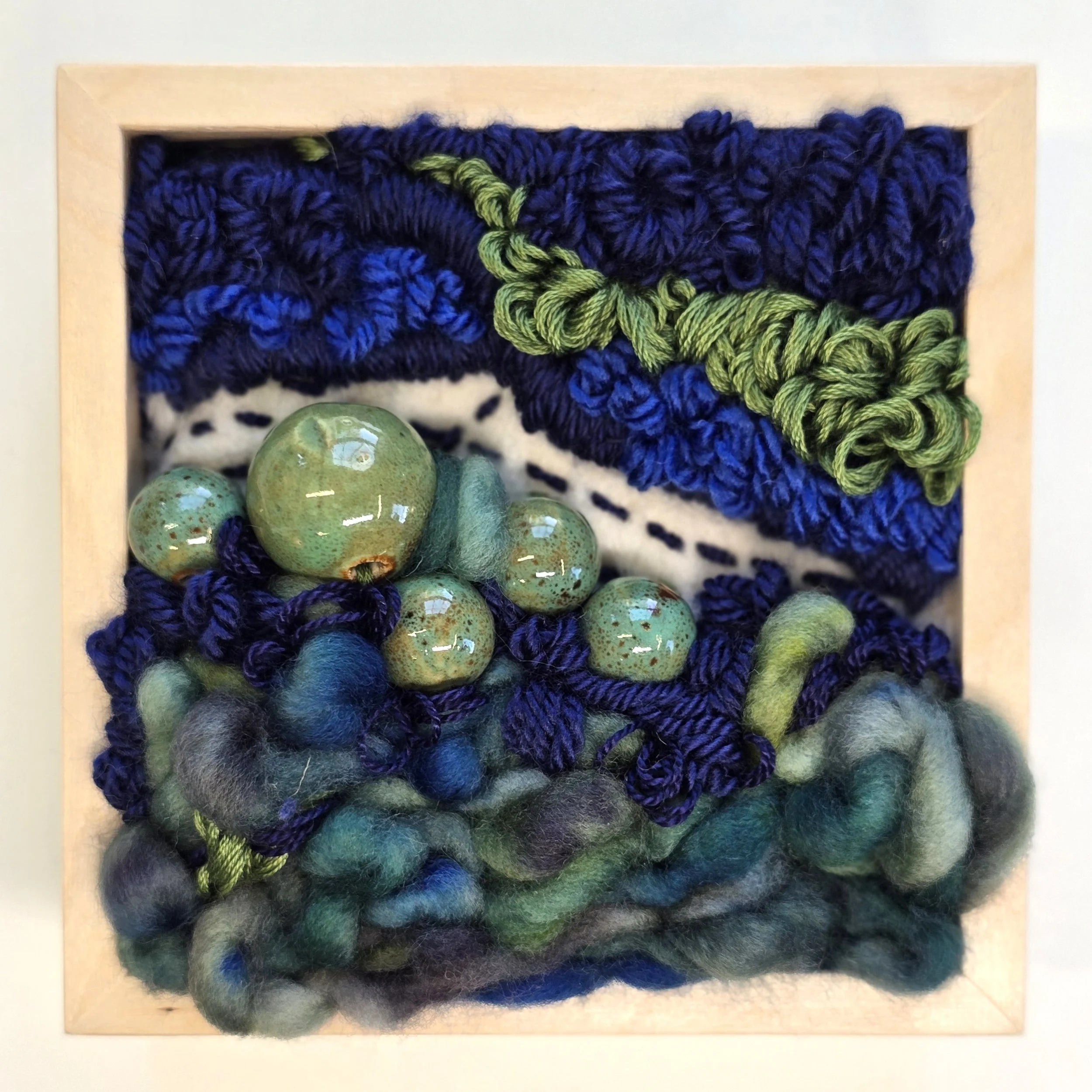 Lake Country | Needle felted wool, handspun art yarn, mixed yarns, & ceramic beads in a solid birch frame with natural finish | 5" x 5" x 2" | $125 (CDN)