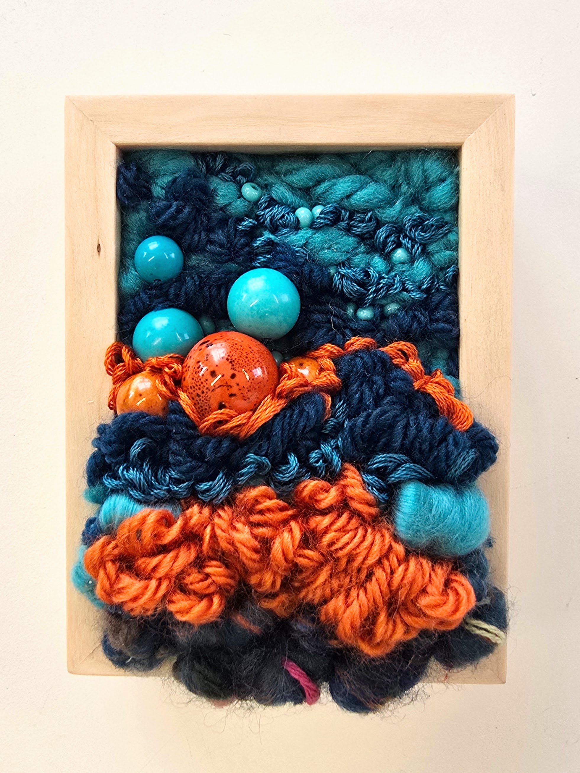 Mini 19 | Stitched mixed yarns, handspun art yarn, wool roving, cotton thread, and stone beading in a solid birch frame with natural finish | 3" x 4" x 1.5" | $50