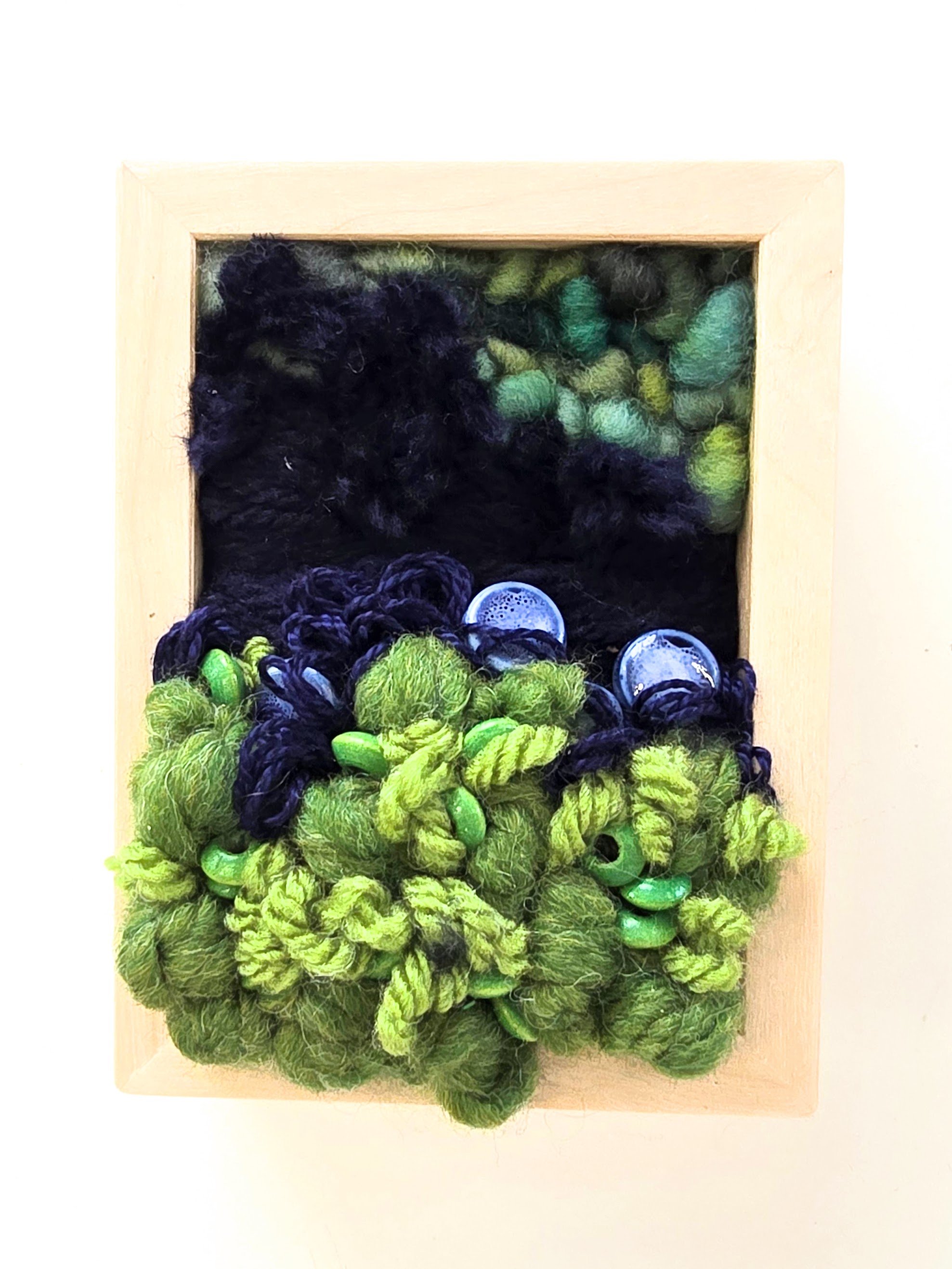 Mini 18 | Stitched mixed yarns, handspun art yarn, cotton thread, and ceramic & painted wood beading in a solid birch frame with natural finish | 3" x 4" x 1.5" | $50