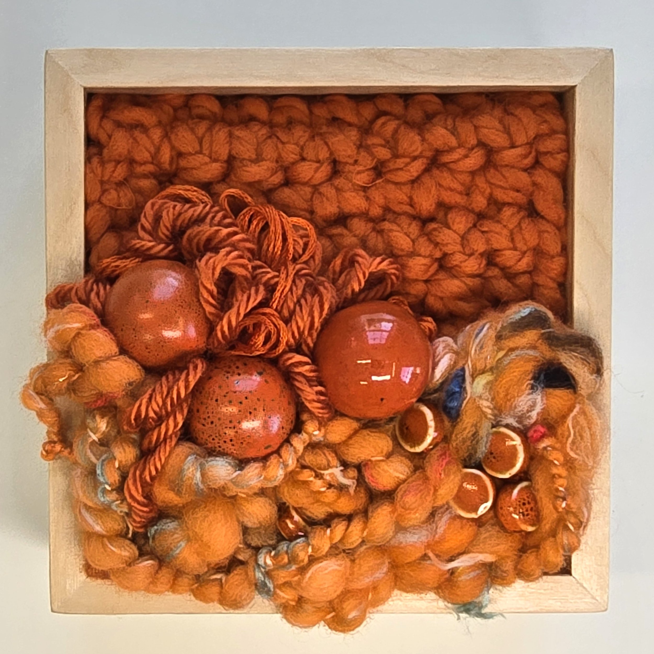Tangerine Dream | Crocheted & handspun art yarn, stitching, & ceramic beads in a solid birch frame with natural finish | 5" x 5" x 2" | $125 (CDN)