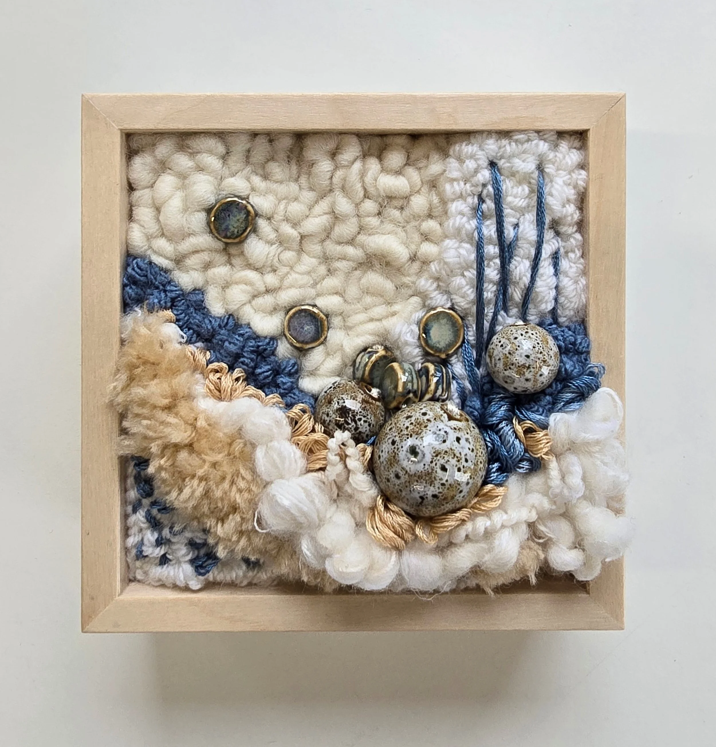 Sand Between Your Toes | Hooked wool, handspun art yarn, mixed yarns, stitching, & ceramic beads in a solid birch frame with natural finish | 5” x 5” x 2” | $125

