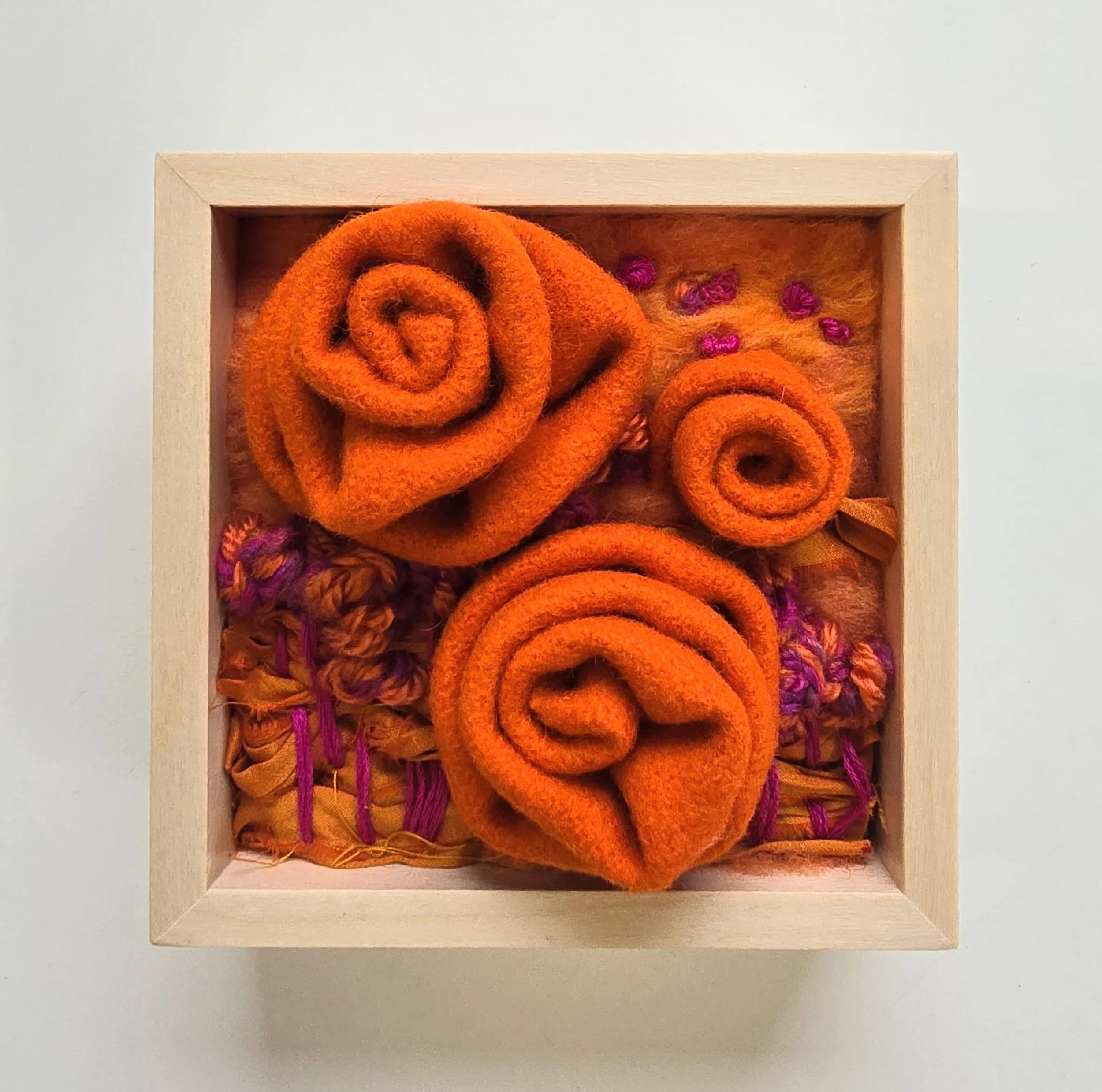 You & Forever | Needle felted wool, wool felt, stitched yarns, recycled sari silk, & embroidery in a solid birch frame with natural finish | 5” x 5” x 2” | $125
