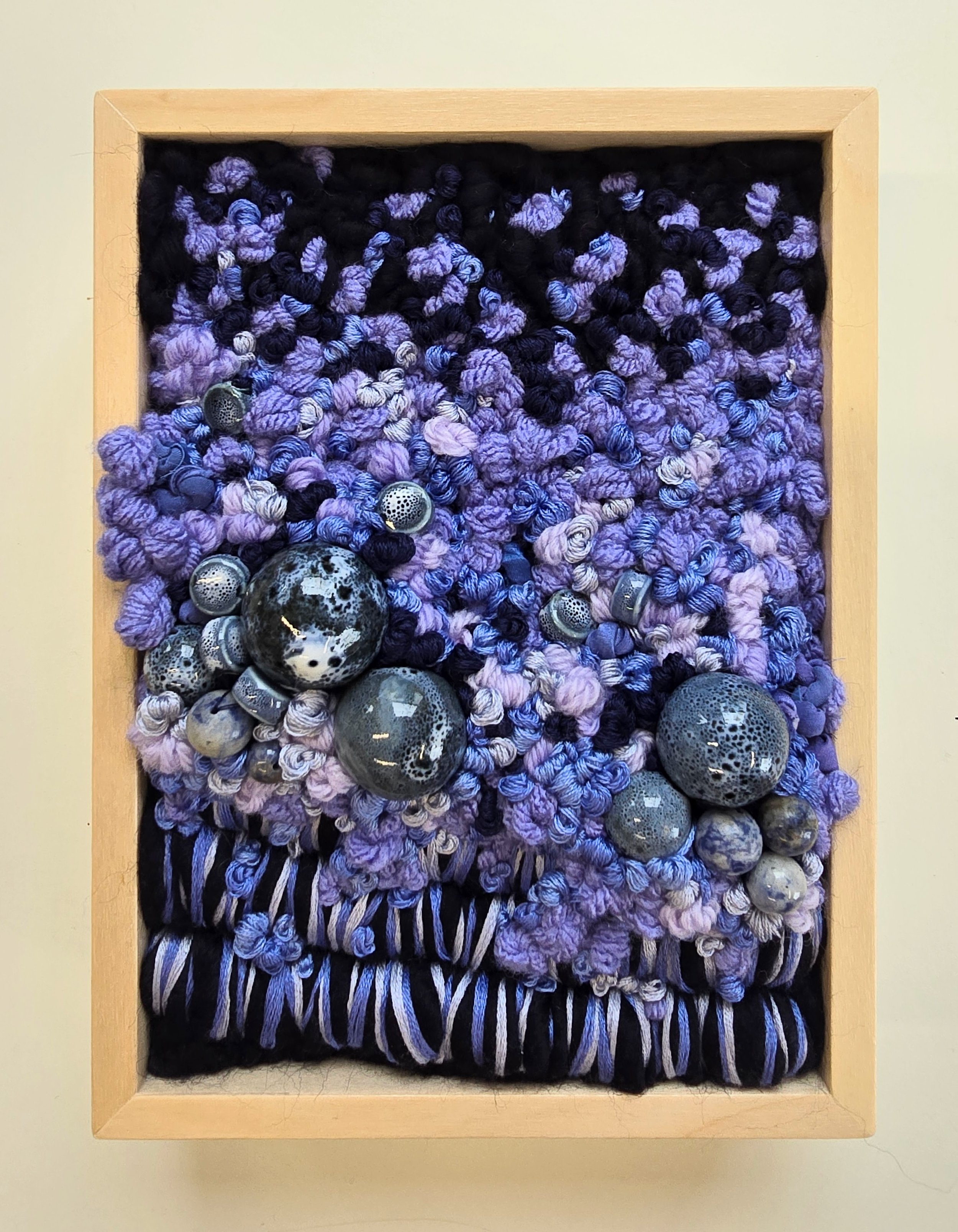 Purple Rain | Hooked wool and mixed yarns, stitched yarns, embroidery, & ceramic beading in a solid birch frame with natural finish | 6” x 8” x 2” | $175
