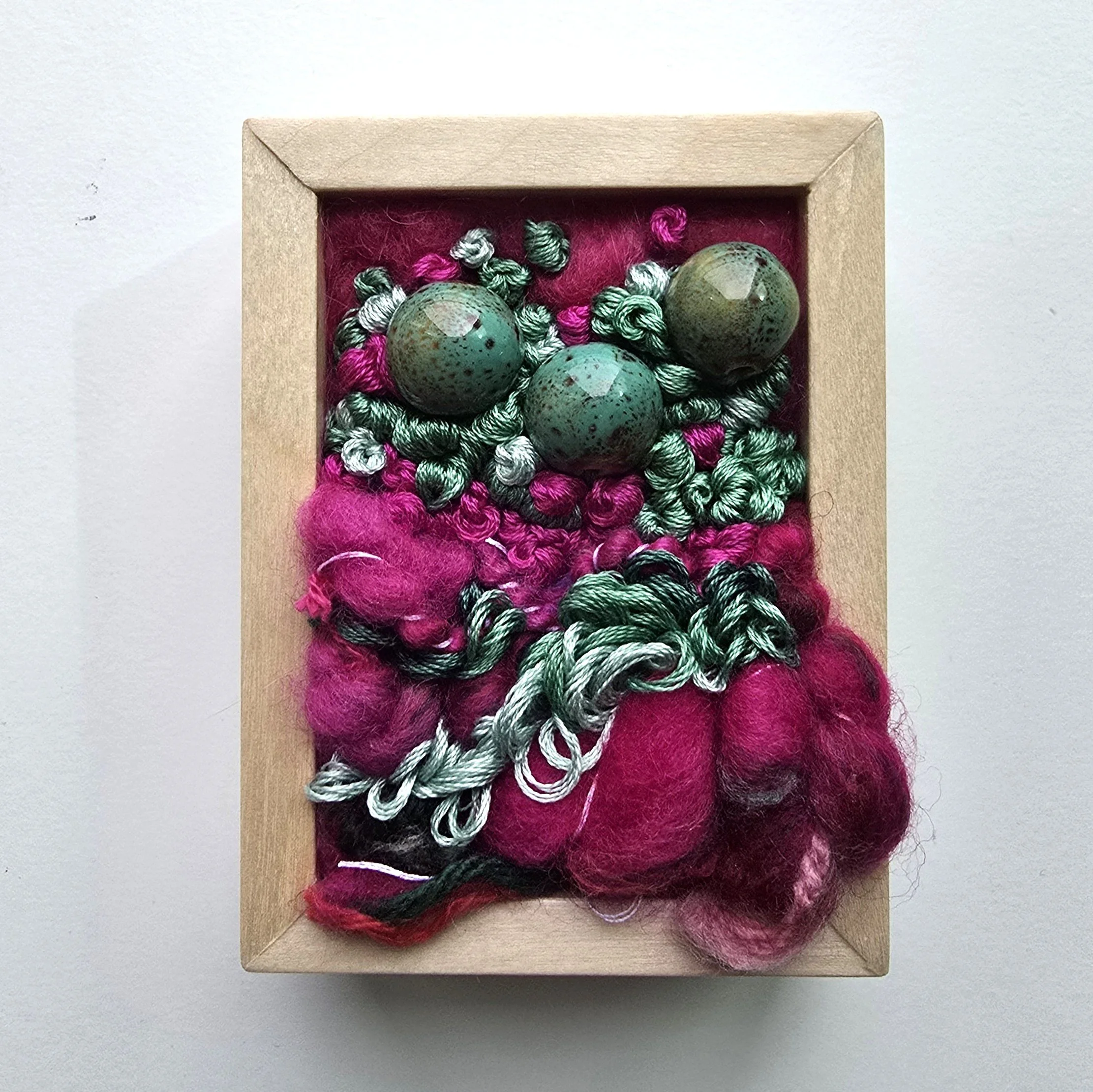 Mini 12 | Needle felted wool, mixed yarns, handspun art yarn, stitching, & ceramic beading in solid birch frame with natural finish | 3" x 4" x 1.5" | $50 (CDN)