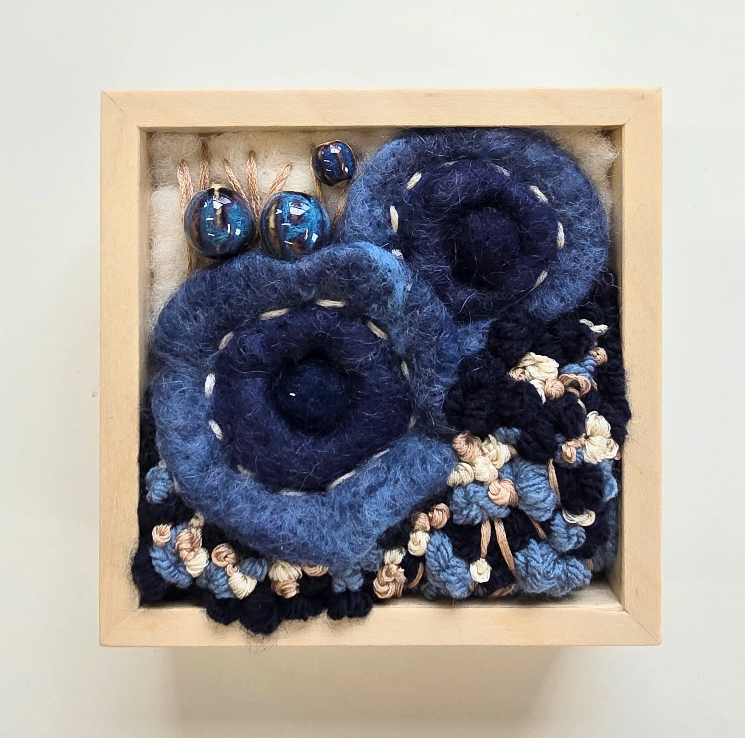Sweet Gesture | Needle felted wool, stitched yarns, embroidery, & ceramic beading in a solid birch frame with natural finish | 5” x 5” x 2” | $125
