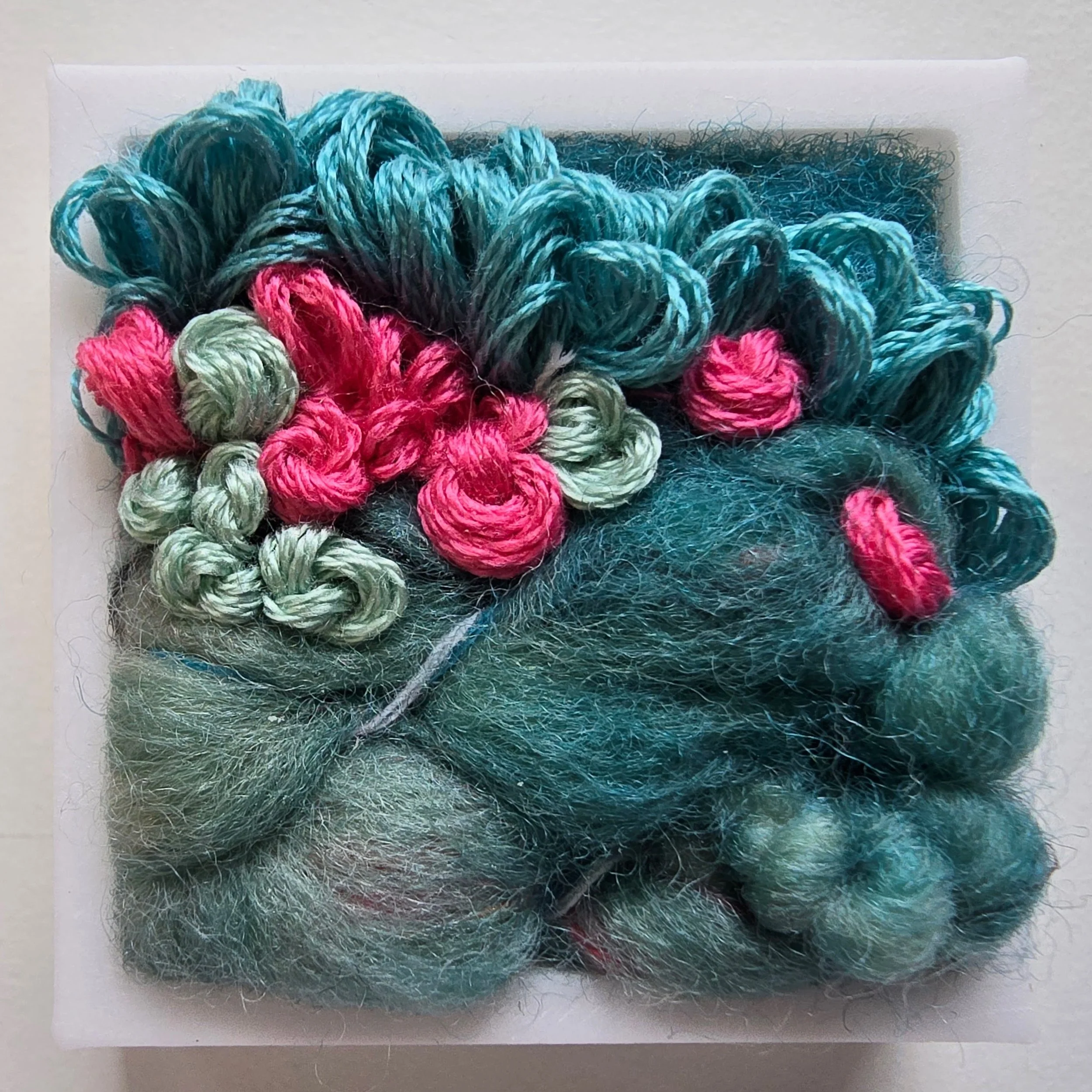 Mini 5 | Needle felted wool, handspun art yarn, & stitching in a white composite frame | 1.75" x 1.75" x 0.5" | $30 (CDN) ***Available at Tiny Ass Art Gallery, St. Jacobs, Ontario in May 2026