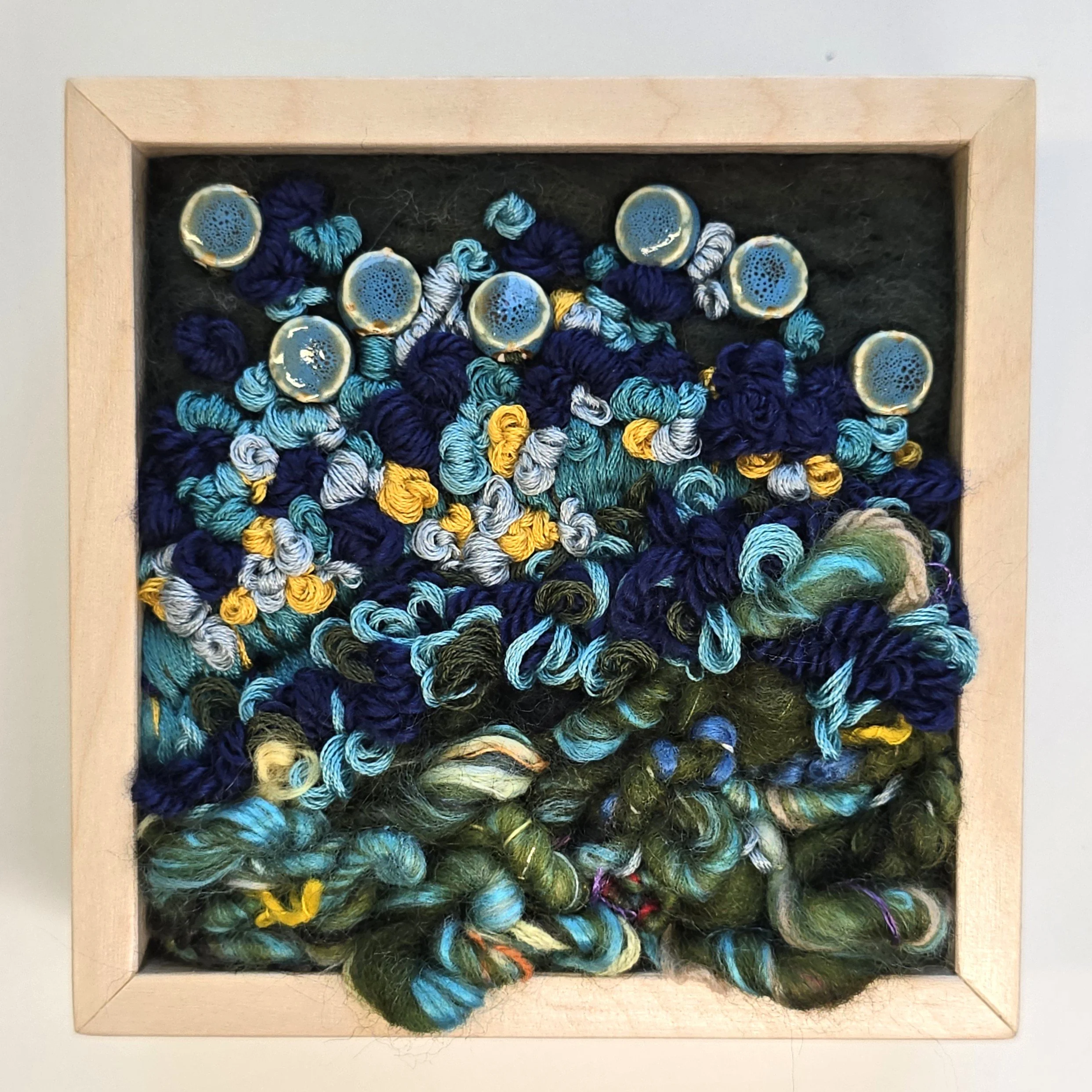 Fistful of Flowers | Needle felted wool, handspun art yarn, stitching, & ceramic beads in a solid birch frame with natural finish | 5" x 5" x 2" | SOLD 