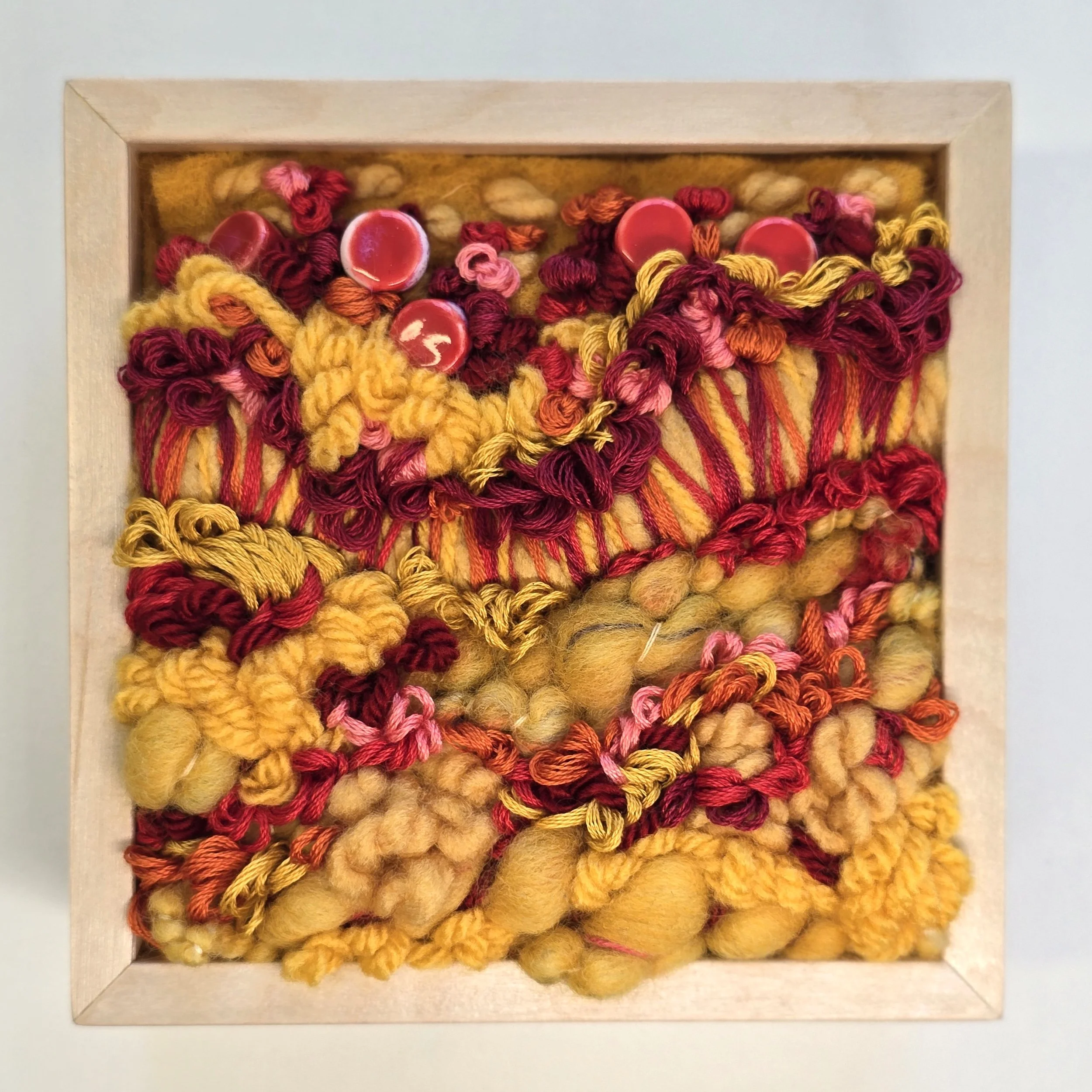 Buttercups & Poppies | Needle felted wool, handspun art yarn, mixed yarns, stitching, & ceramic beads in a solid birch frame with natural finish | 5" x 5" x 2" | $125 (CDN) 