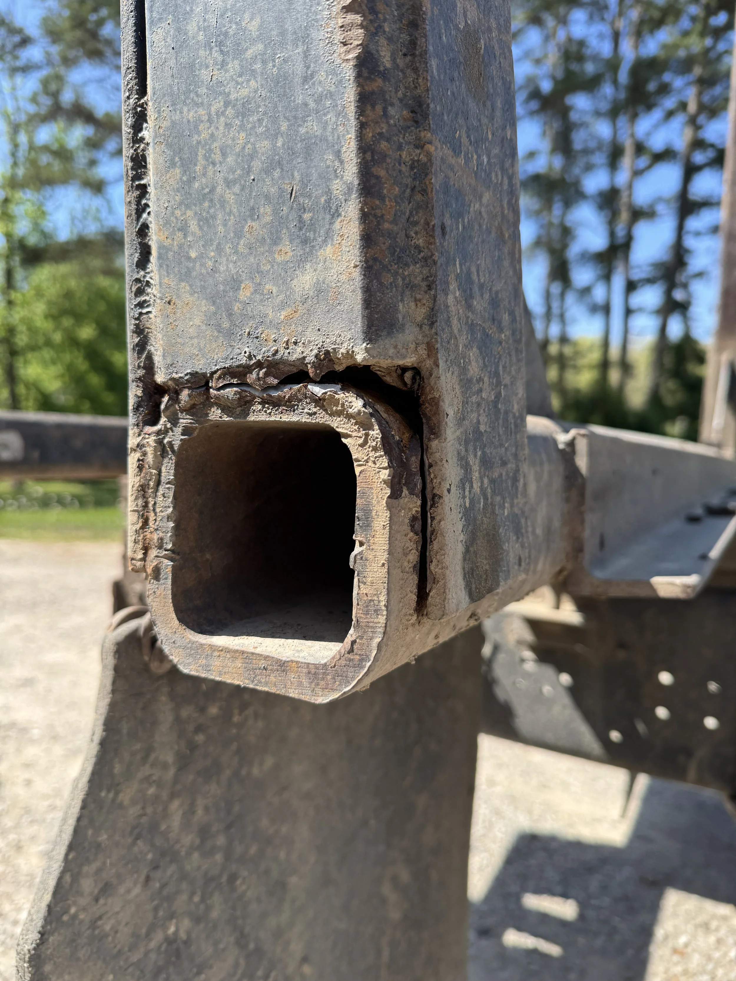 Cracked 1/4 inch square tube on log truck frame before welding repair in London Kentucky