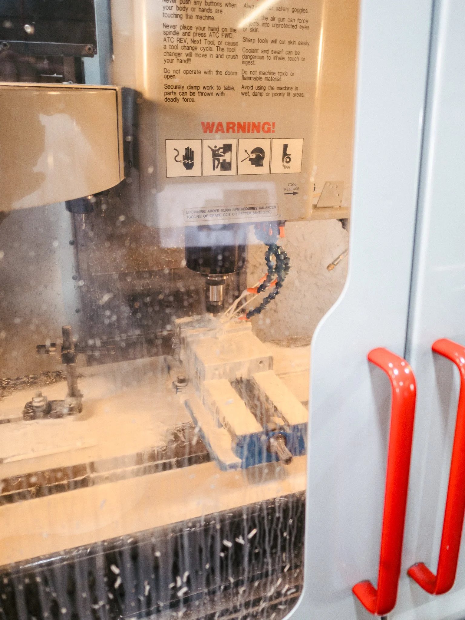 CNC machine cutting aluminum for affordable alternative to Bay Area machine shops