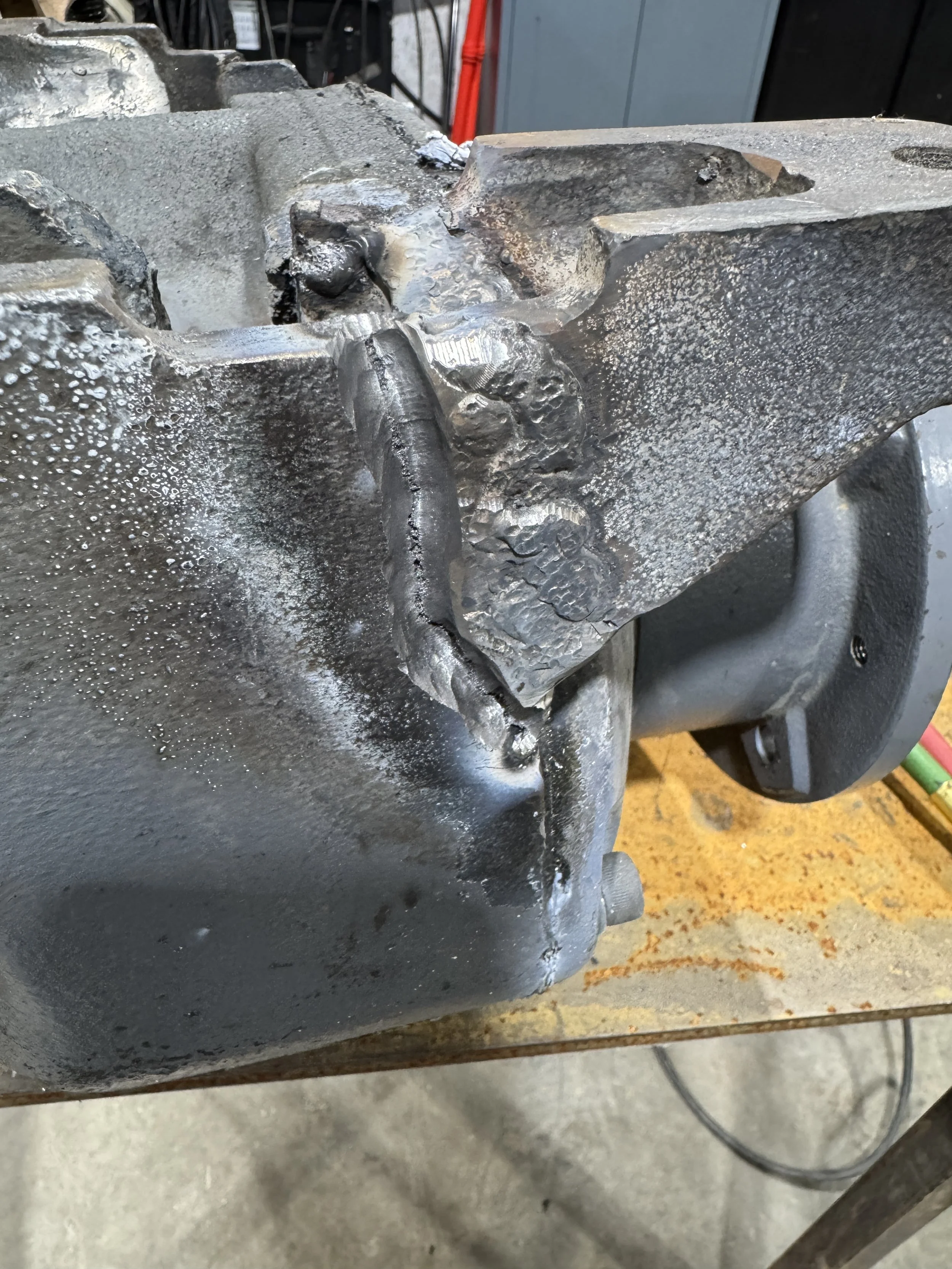  Damaged cast iron equipment housing before welding repair at McCarty Fabrication. 