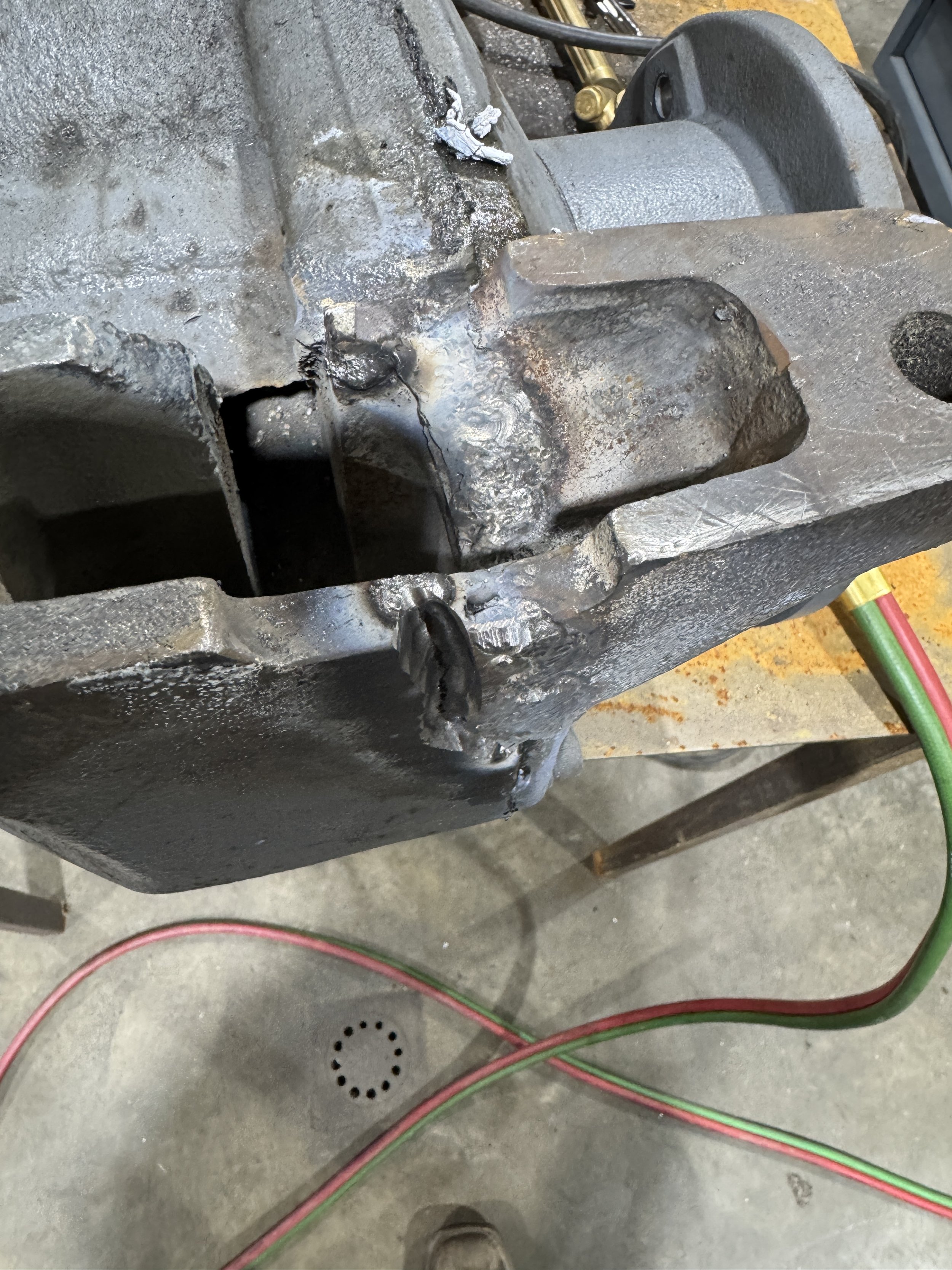  Cast iron housing being rebuilt with controlled weld passes during repair. 