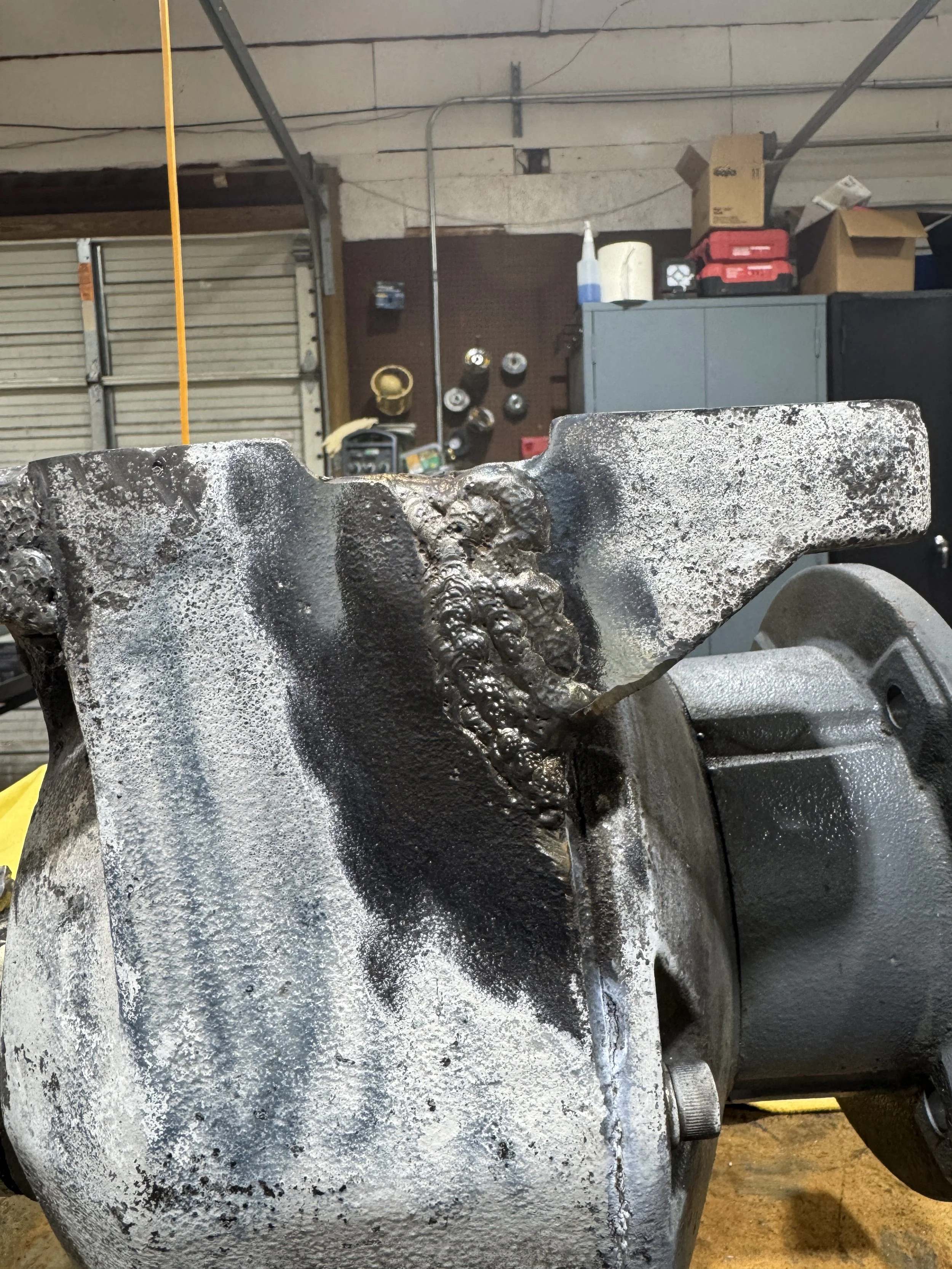  Repaired cast iron housing showing welded and rebuilt sections. 