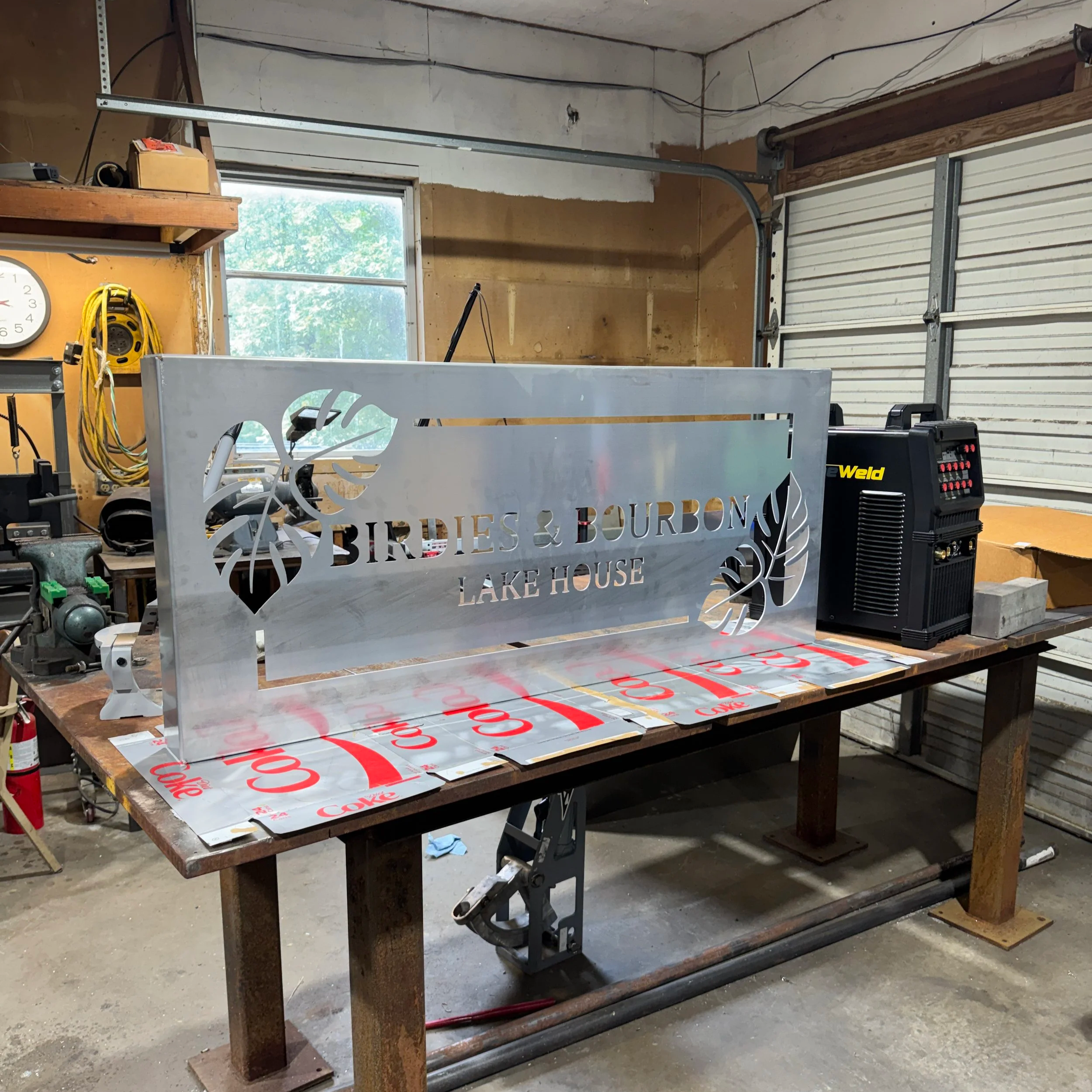 Custom Birdies & Bourbon Lake House sign during raw aluminum fabrication before powder coating and assembly