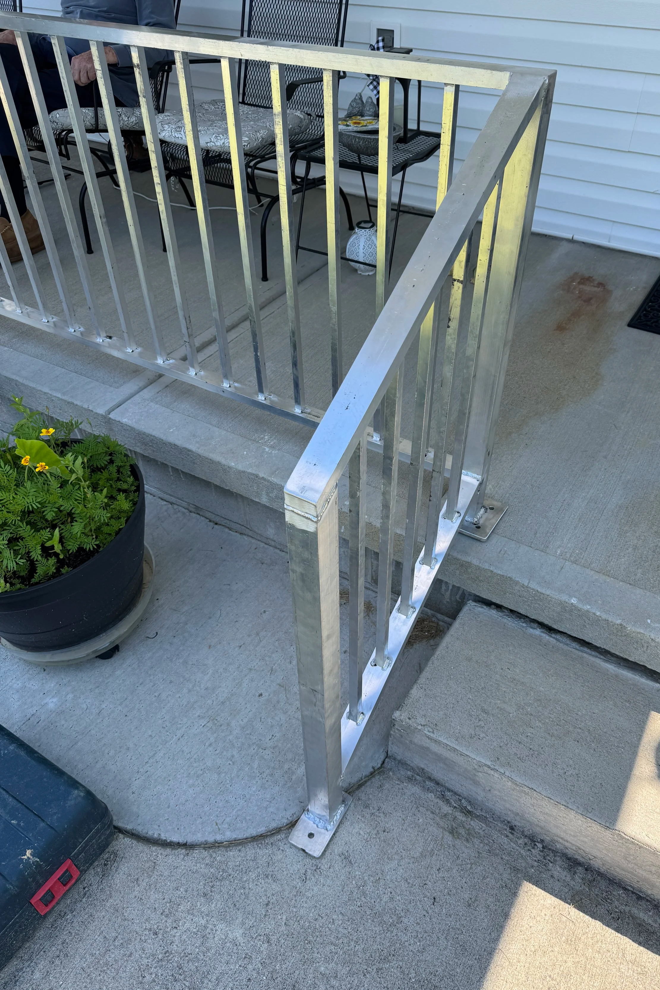 Custom aluminum porch handrail fabricated and installed at a residential home in Corbin, Kentucky.