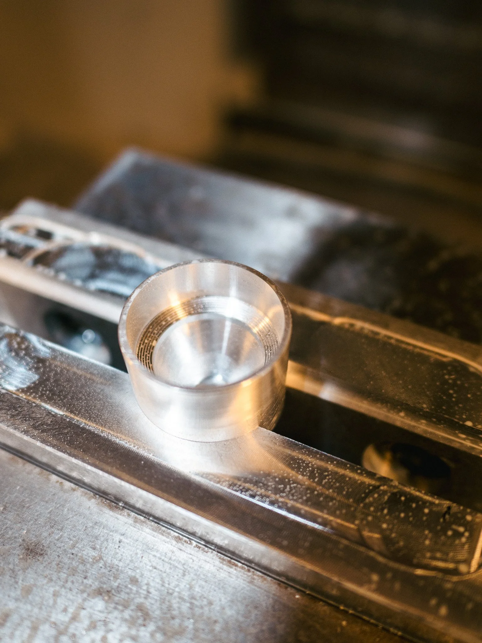 CNC machined suppressor baffle manufactured under 07 FFL and 02 SOT licensing for defense and R&D programs